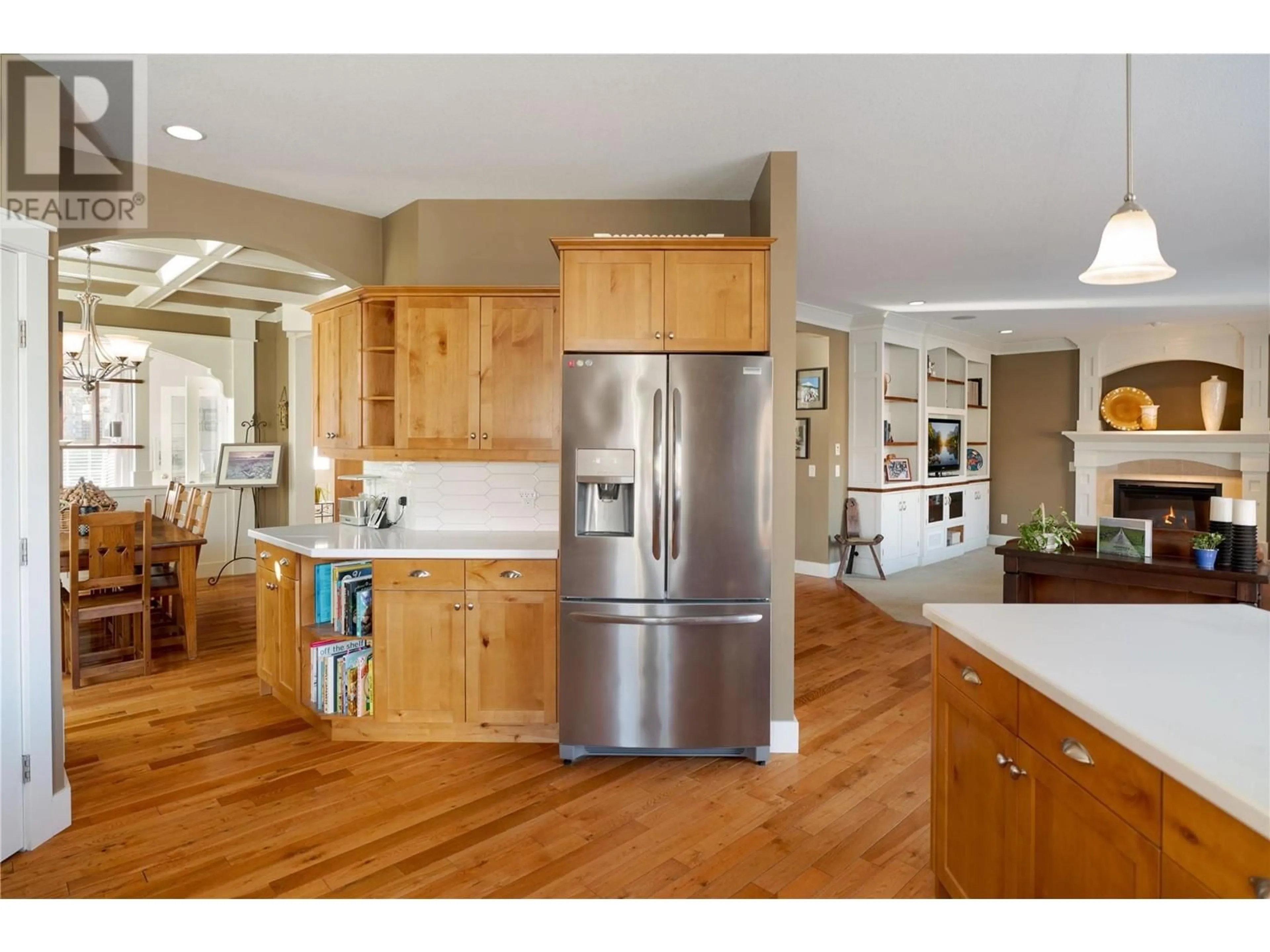 Open concept kitchen, wood/laminate floor for 343 Quilchena Drive, Kelowna British Columbia V1W4Y9