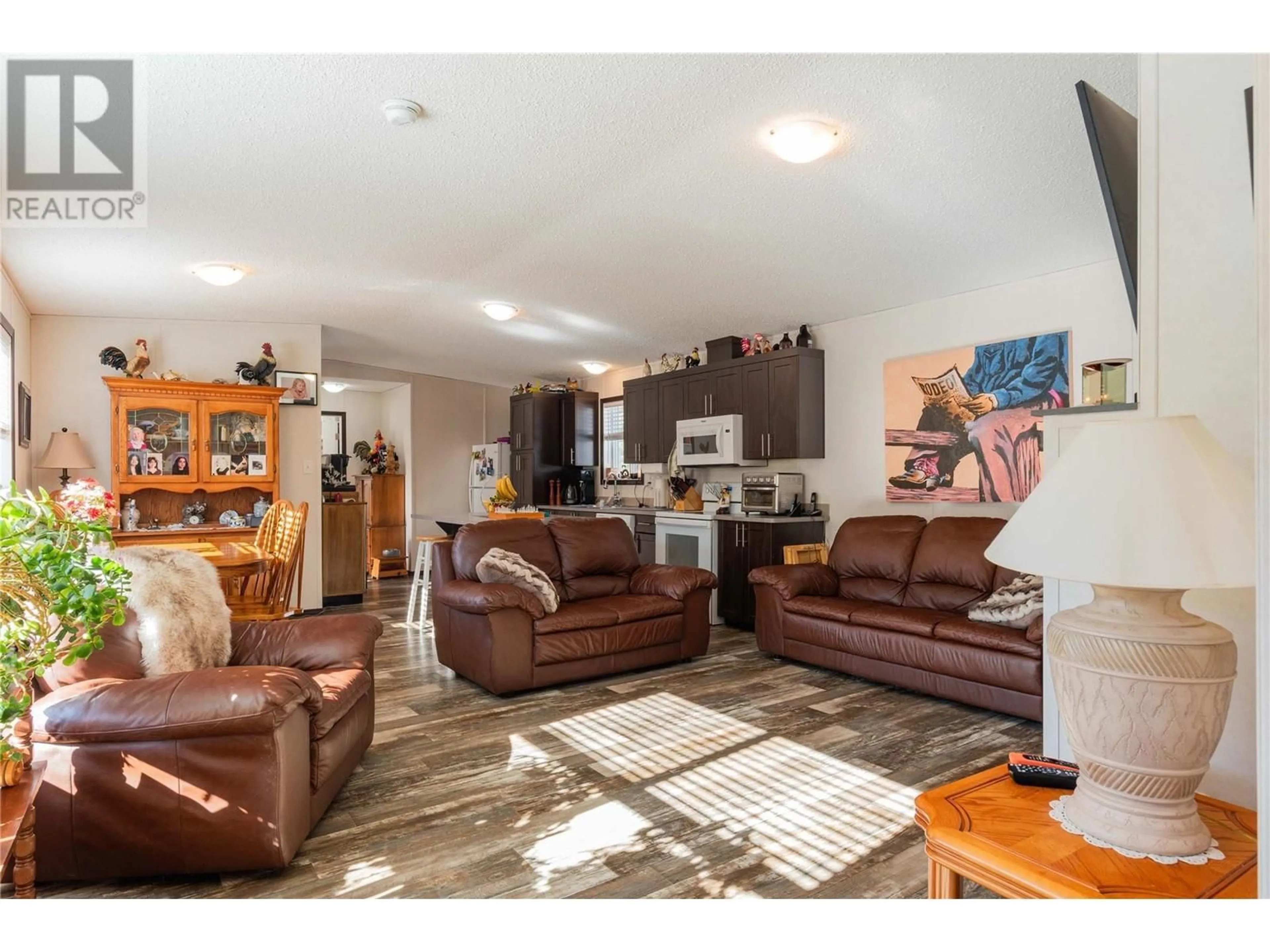 Living room with furniture, wood/laminate floor for 4248 Ross Spur Road, Ross Spur British Columbia V0G1L1