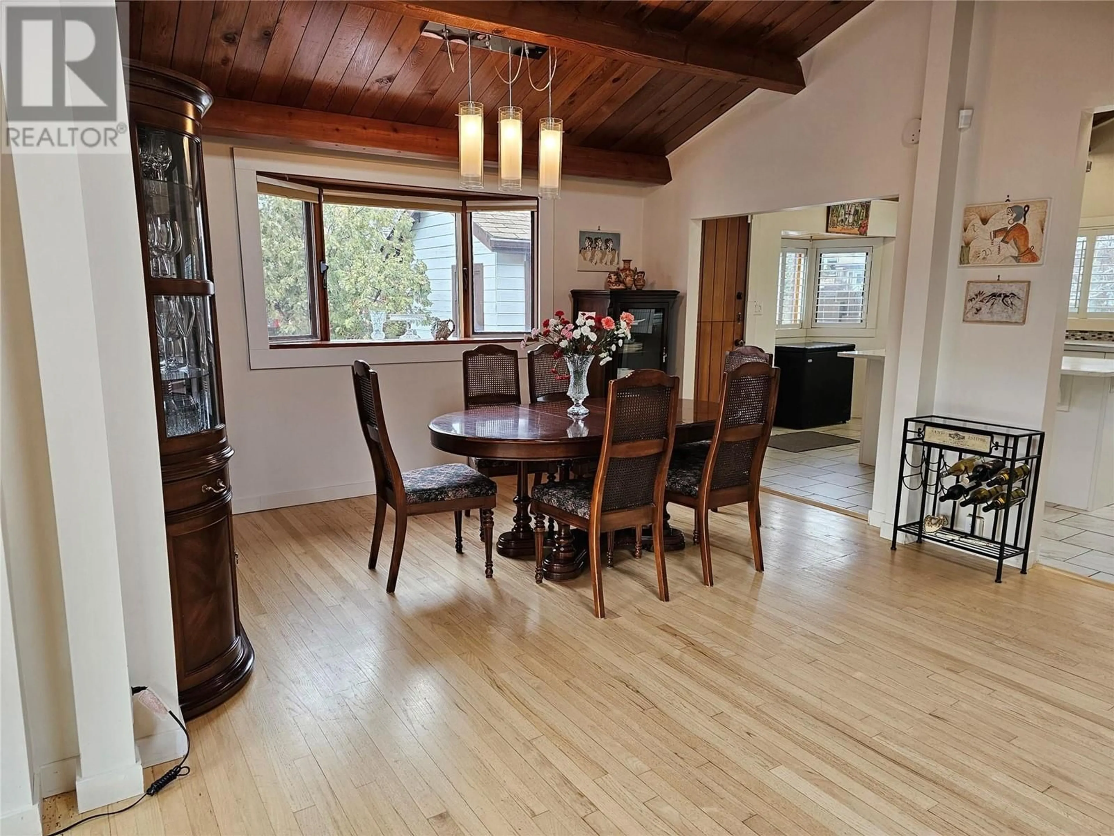 Dining room, wood/laminate floor for 902 Barrington Avenue, Penticton British Columbia V2A1S3