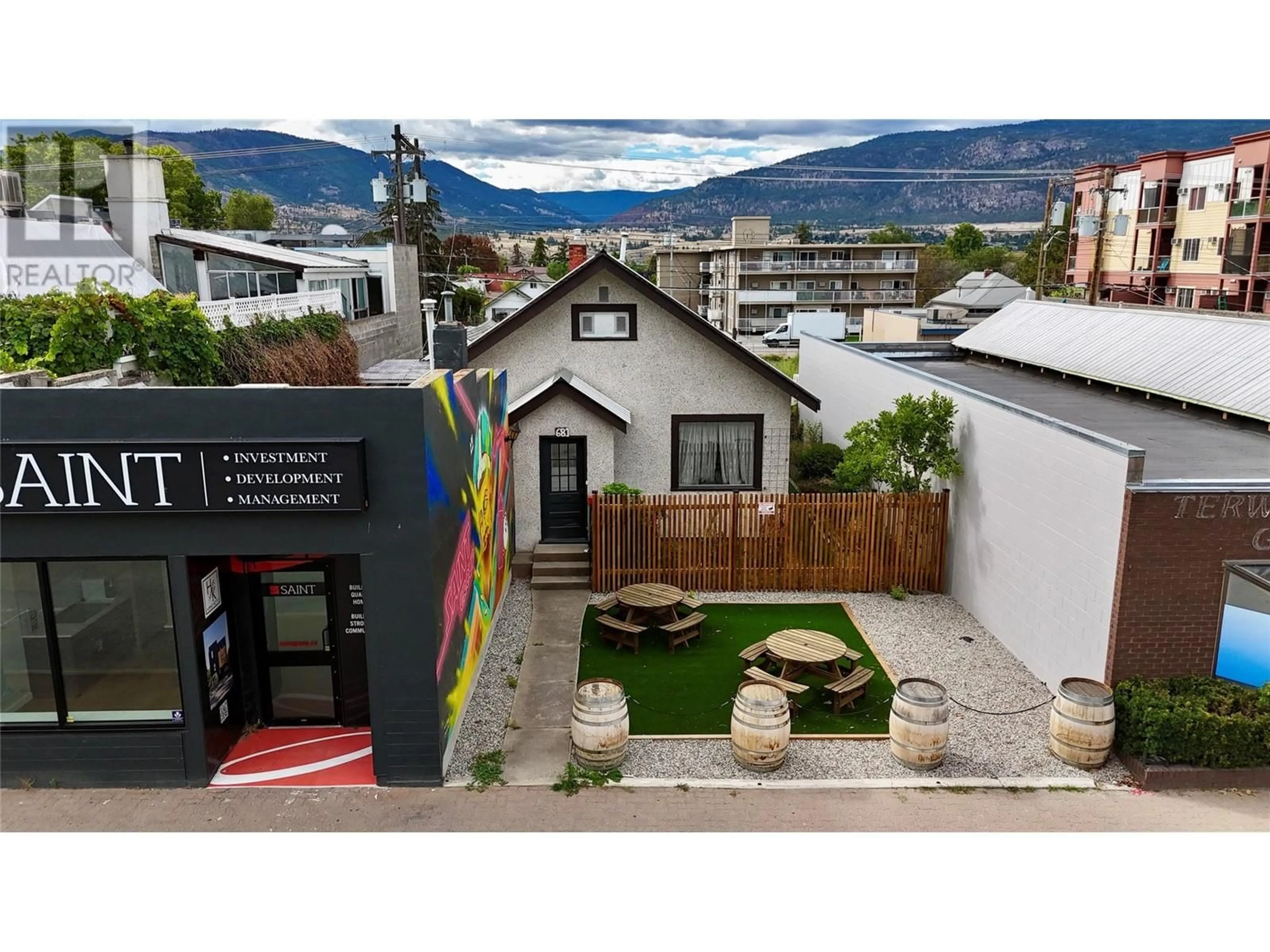 A pic from outside/outdoor area/front of a property/back of a property/a pic from drone, mountain view for 681 Main Street, Penticton British Columbia V2A5C9