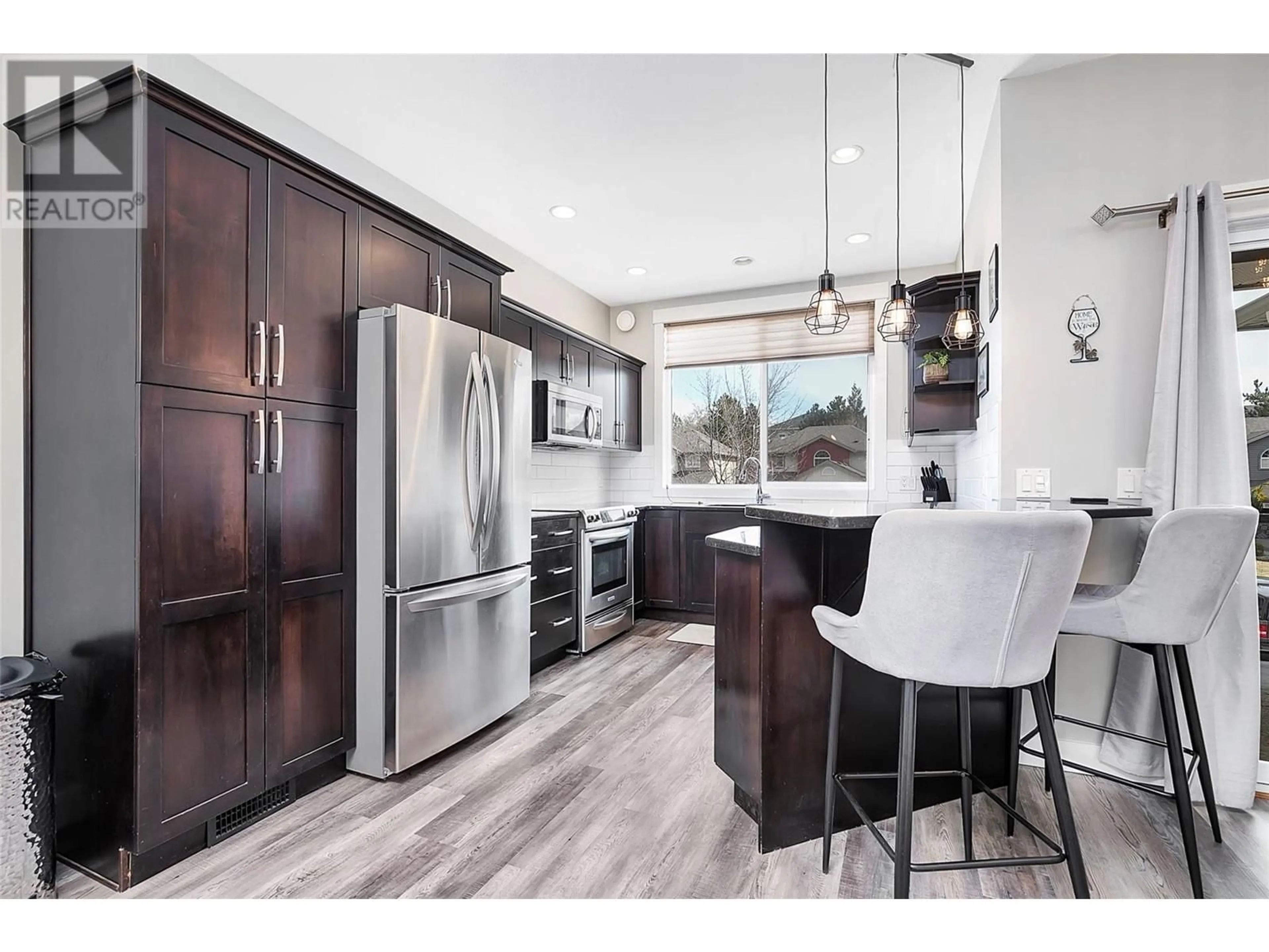 Open concept kitchen, wood/laminate floor for 3277 Broadview Road Unit# 6, West Kelowna British Columbia V4T3C8