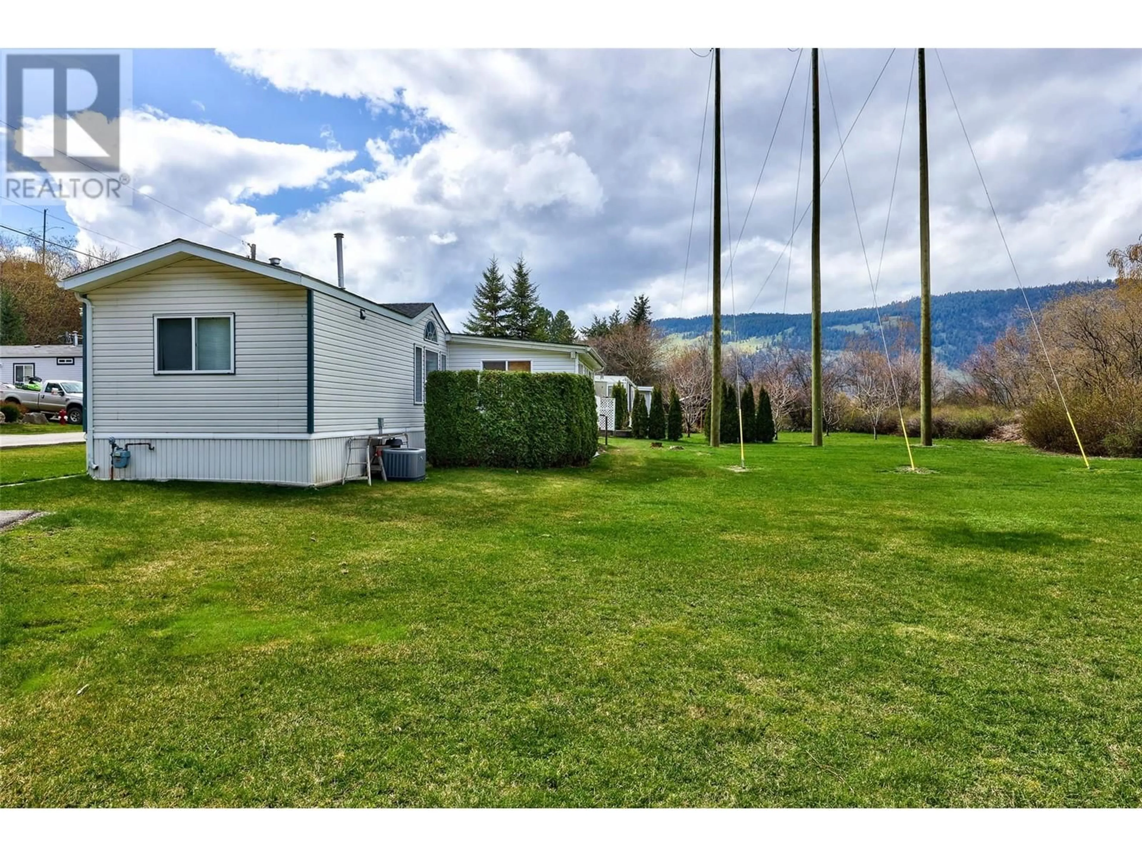 A pic from outside/outdoor area/front of a property/back of a property/a pic from drone, mountain view for 1250 Hillside Avenue Unit# 36, Chase British Columbia V0E1M0