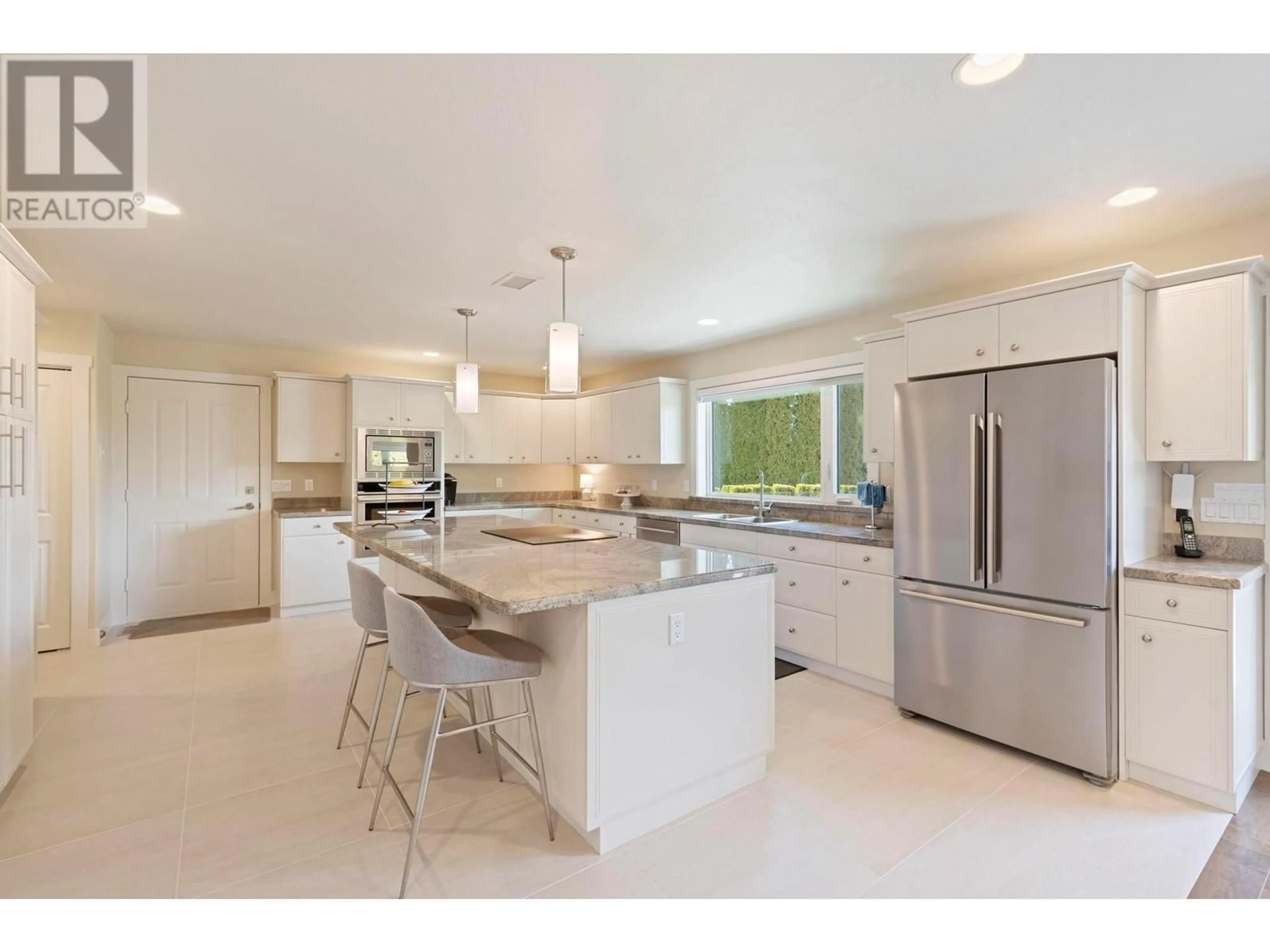 Open concept kitchen, ceramic/tile floor for 292 Sandpiper Court, Kelowna British Columbia V1W4K7