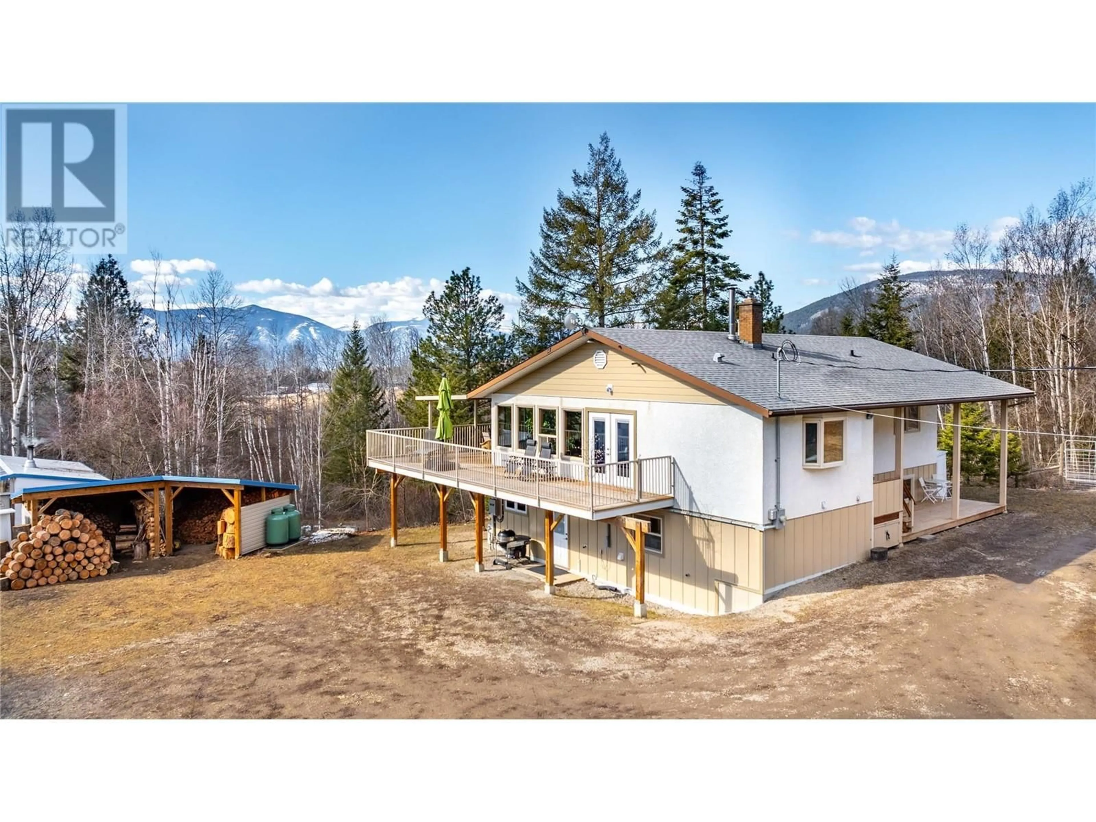 A pic from outside/outdoor area/front of a property/back of a property/a pic from drone, mountain view for 3421 CANYON LISTER Road, Canyon British Columbia V0B1C1