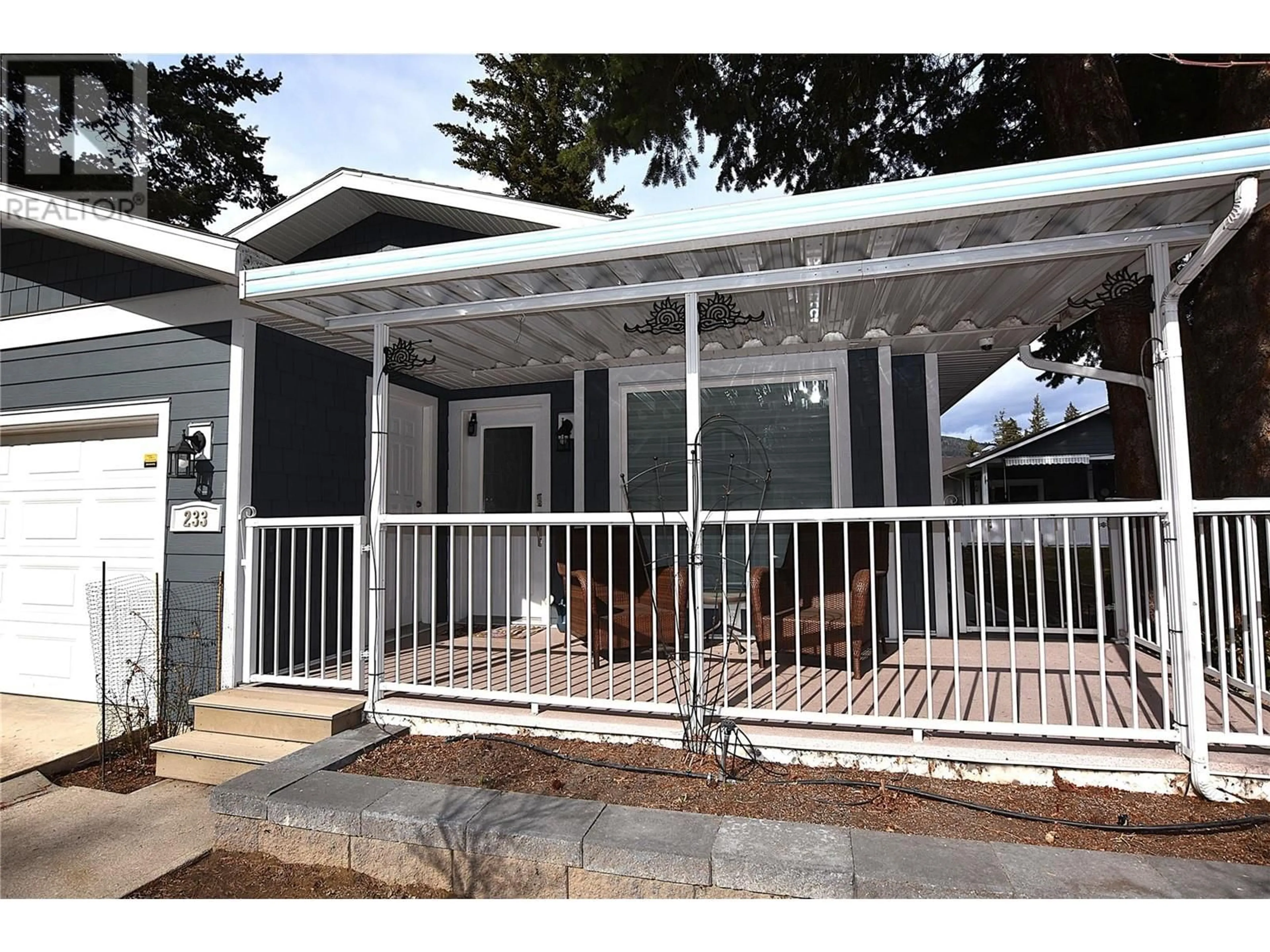 Home with vinyl exterior material, street for 233 234 FALCON AVENUE, Vernon British Columbia V1H2A1