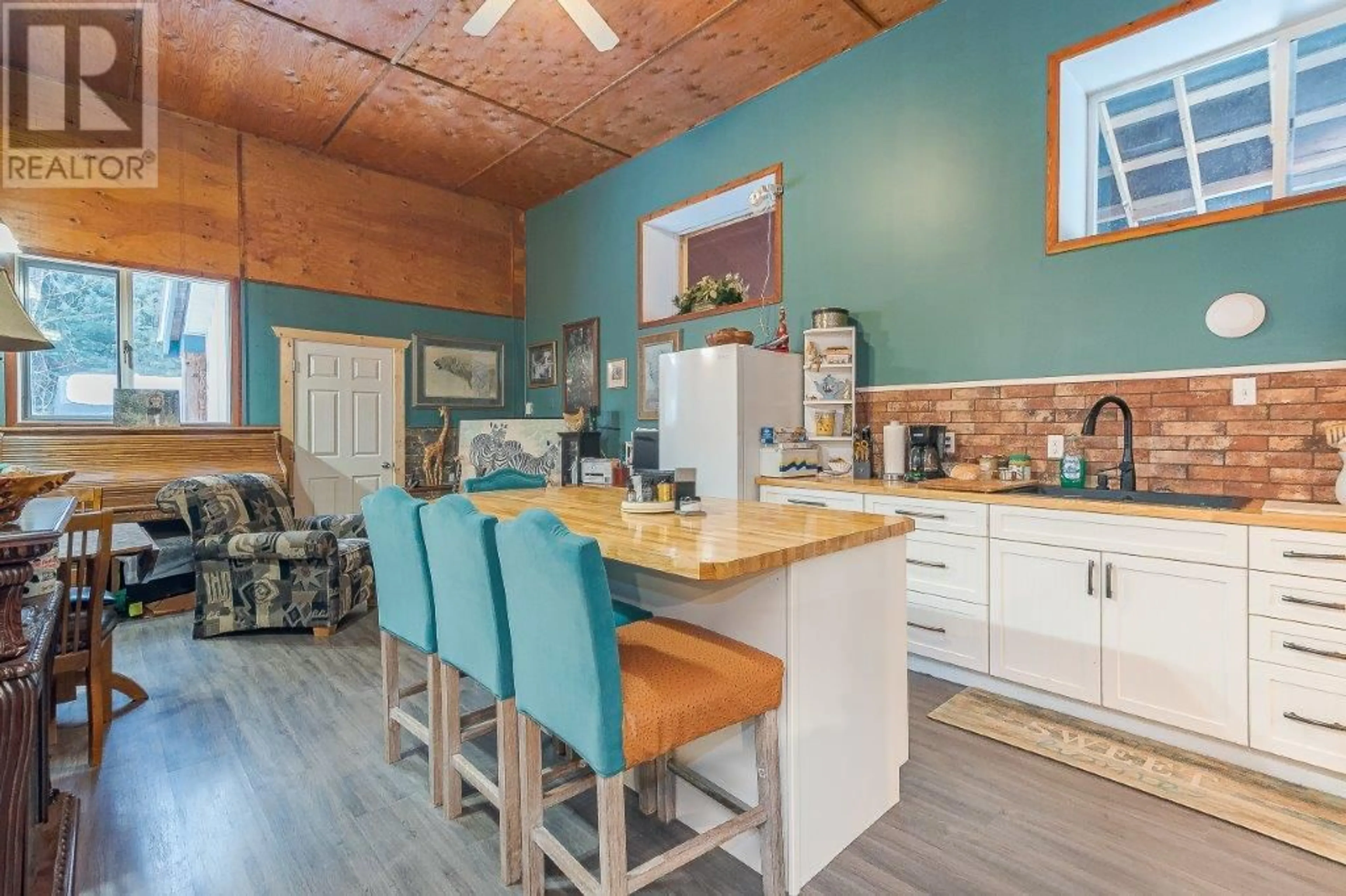 Open concept kitchen, wood/laminate floor for 3953 MALAKWA ROAD, Malakwa British Columbia V0E2J0