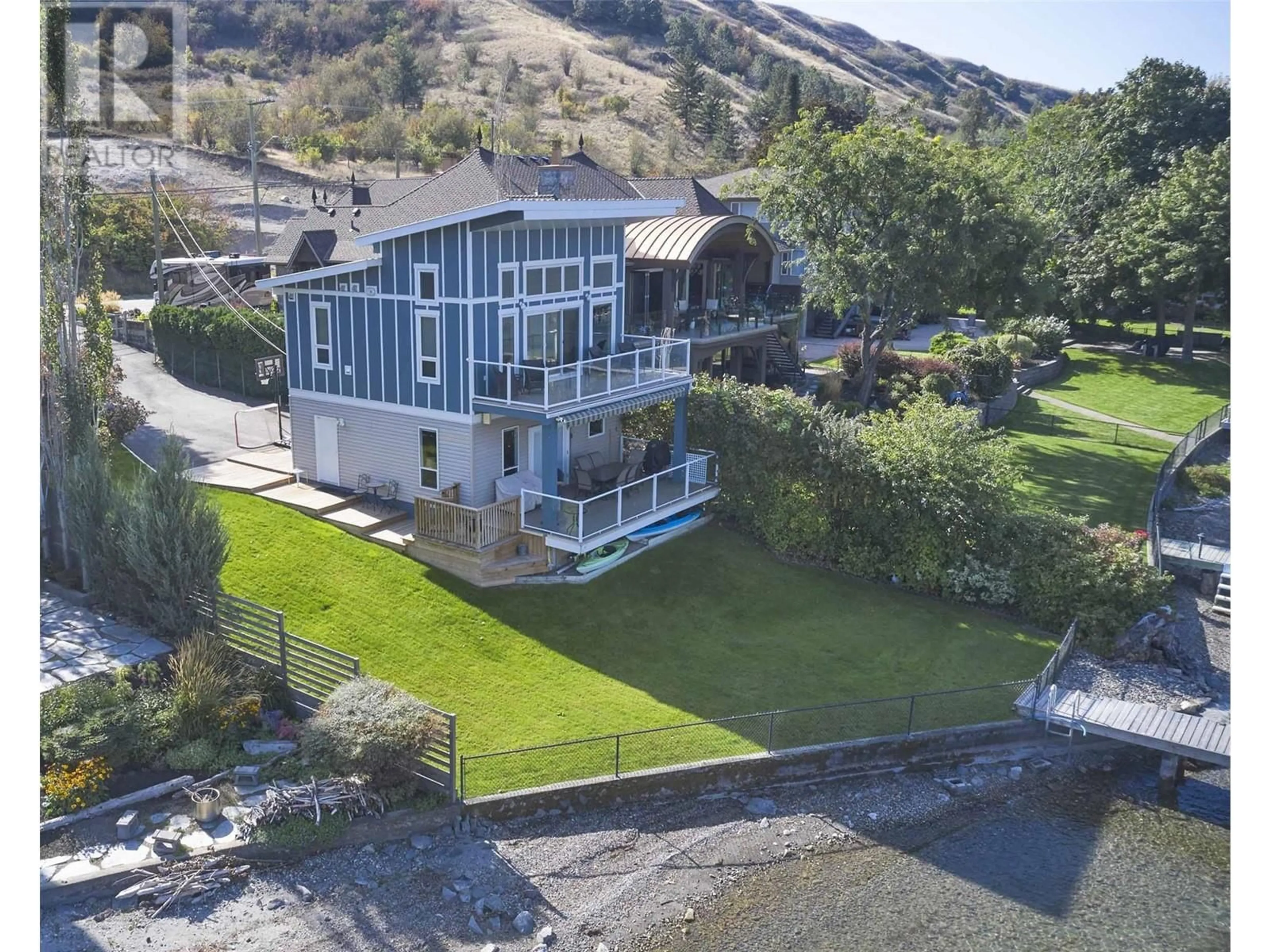 A pic from outside/outdoor area/front of a property/back of a property/a pic from drone, water/lake/river/ocean view for 8337 Okanagan Landing Road, Vernon British Columbia V1H1J5