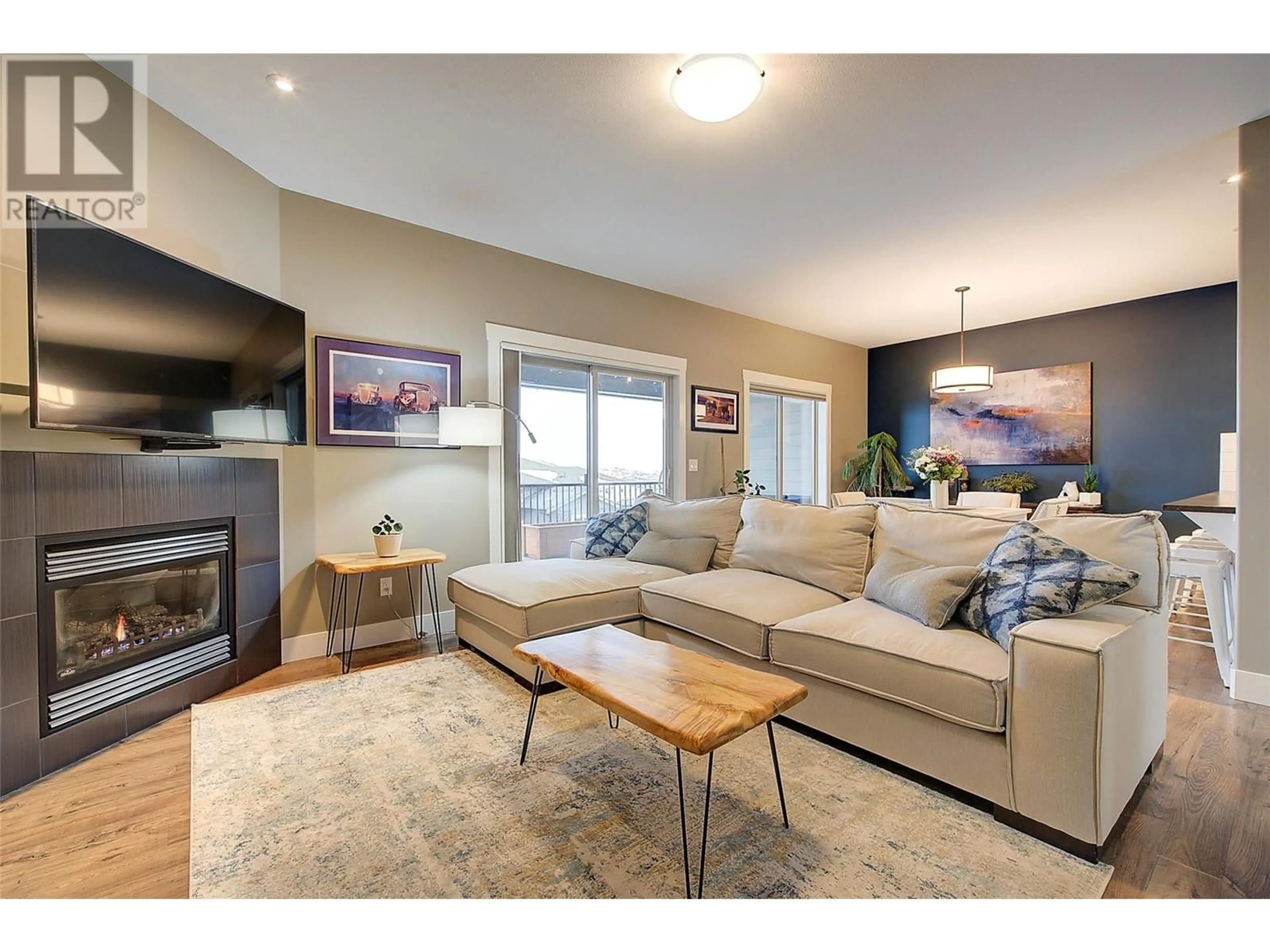 Living room with furniture, wood/laminate floor for 1040 Mt Revelstoke Place Unit# 20, Vernon British Columbia V1B4E3