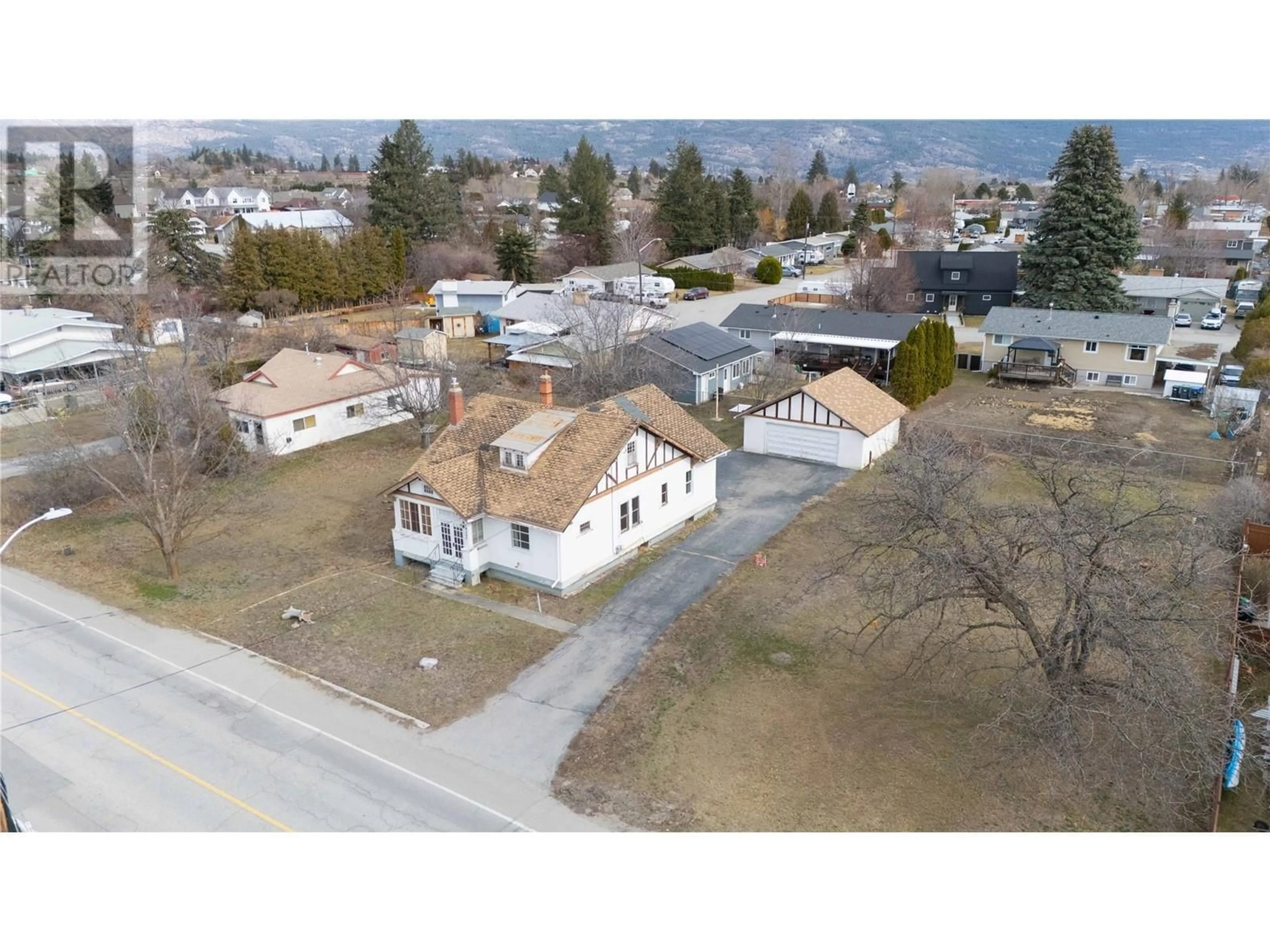 A pic from outside/outdoor area/front of a property/back of a property/a pic from drone, street for 14207 VICTORIA ROAD NORTH, Summerland British Columbia V0H1Z0