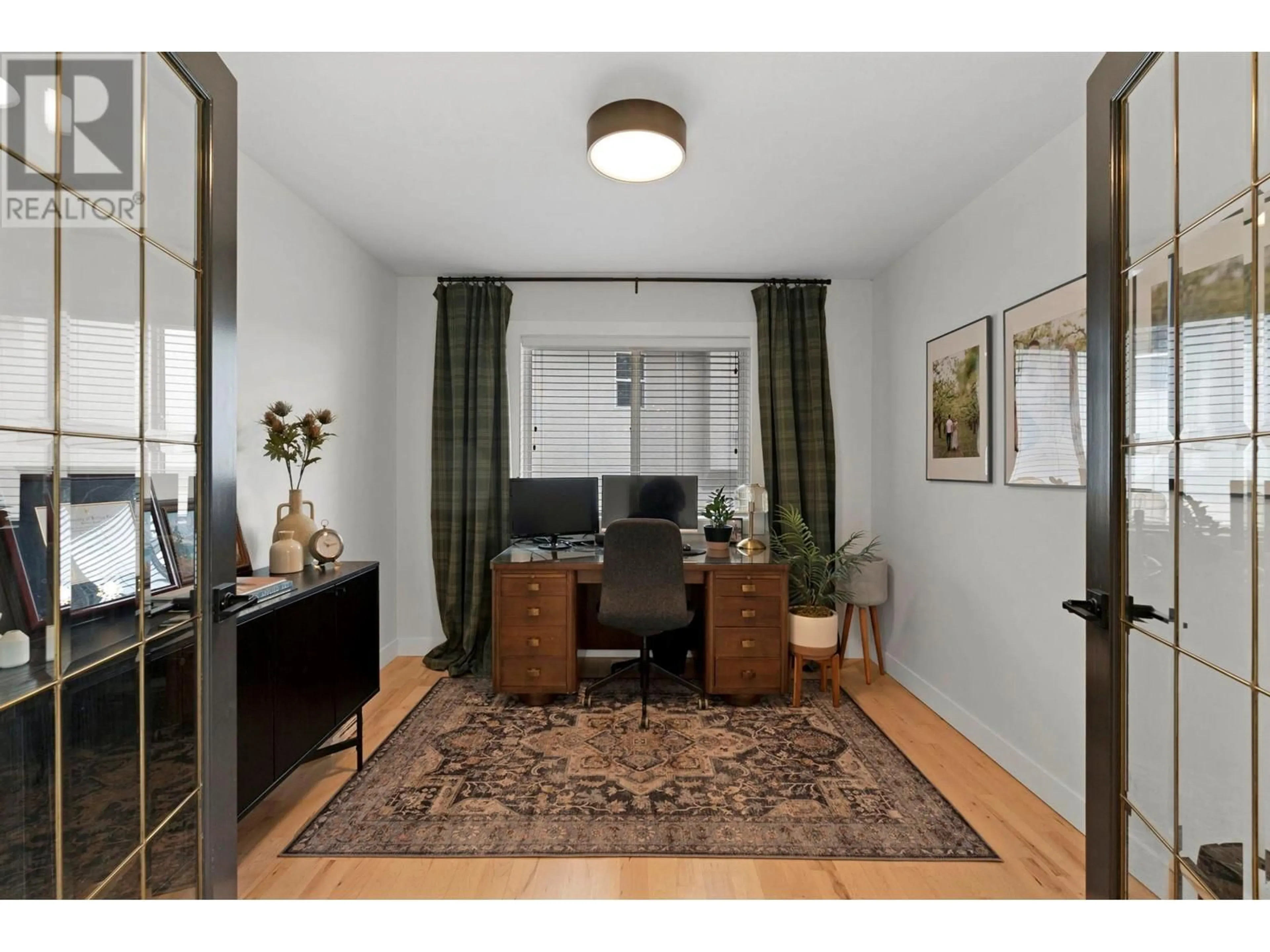 Living room with furniture, wood/laminate floor for 2196 LILLOOET CRESCENT, Kelowna British Columbia V1V1W3