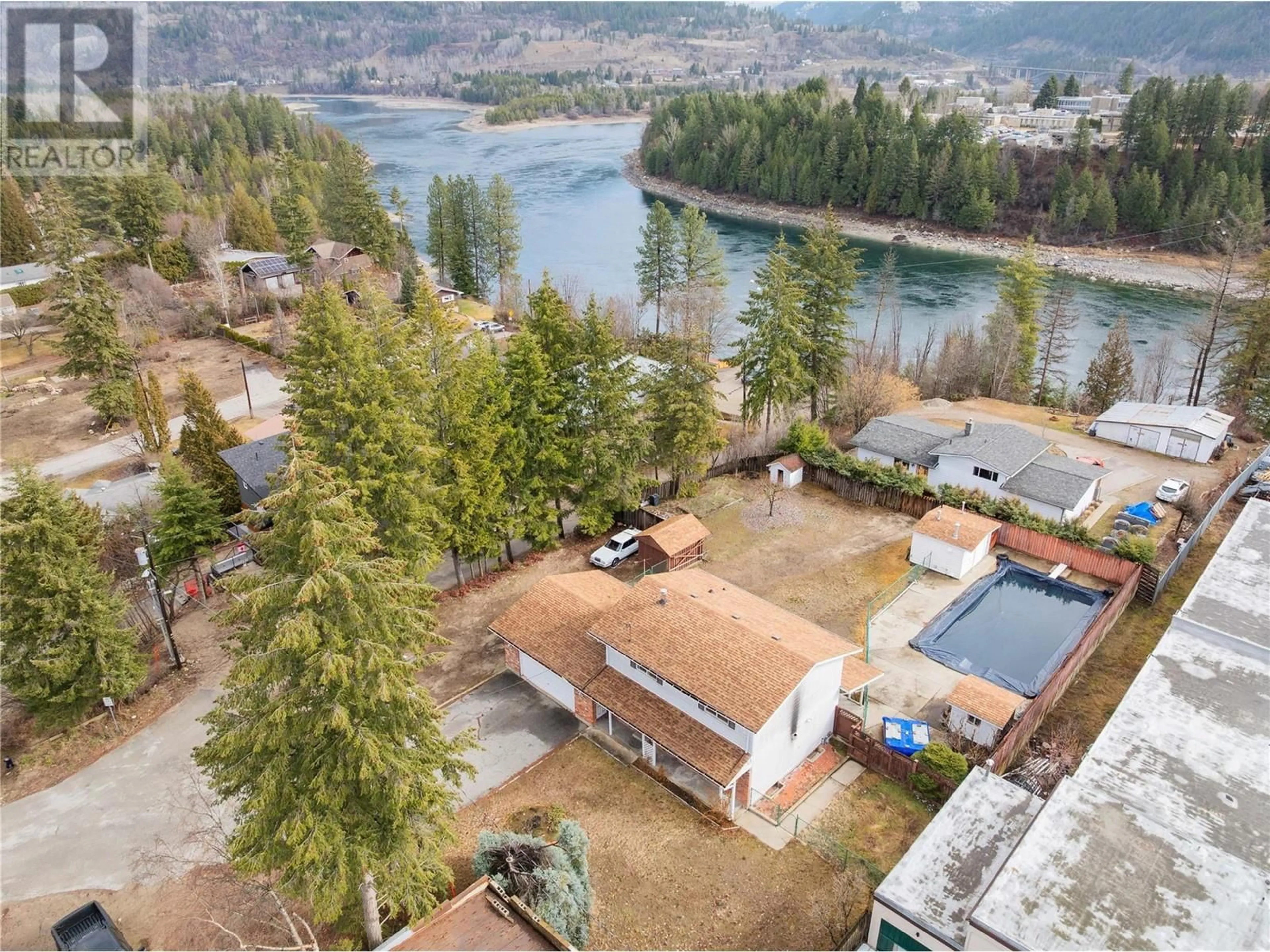 A pic from outside/outdoor area/front of a property/back of a property/a pic from drone, water/lake/river/ocean view for 614 12TH STREET, Castlegar British Columbia V1N2K3