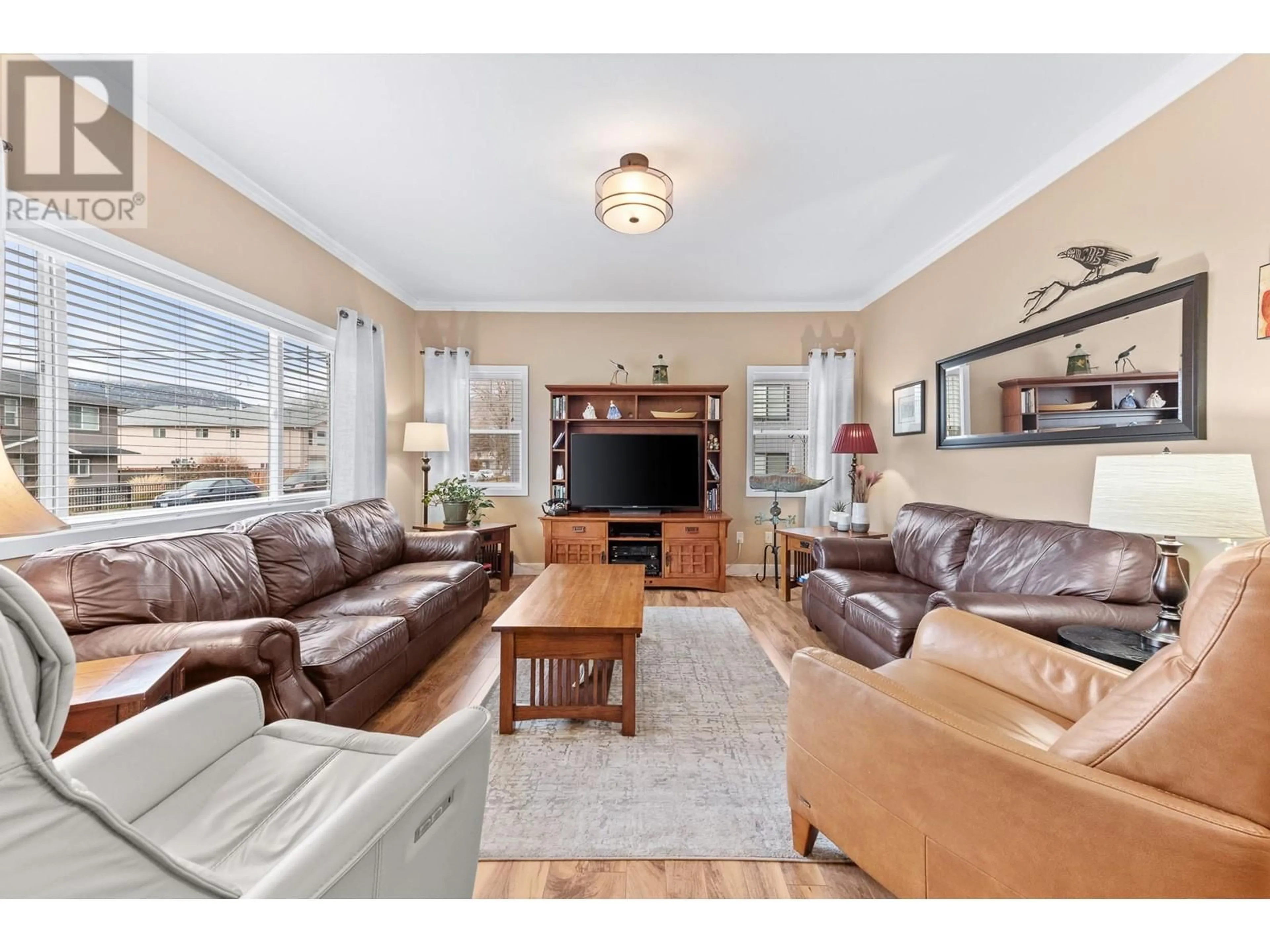 Living room with furniture, wood/laminate floor for 294 BASSETT Street, Penticton British Columbia V2A5W3