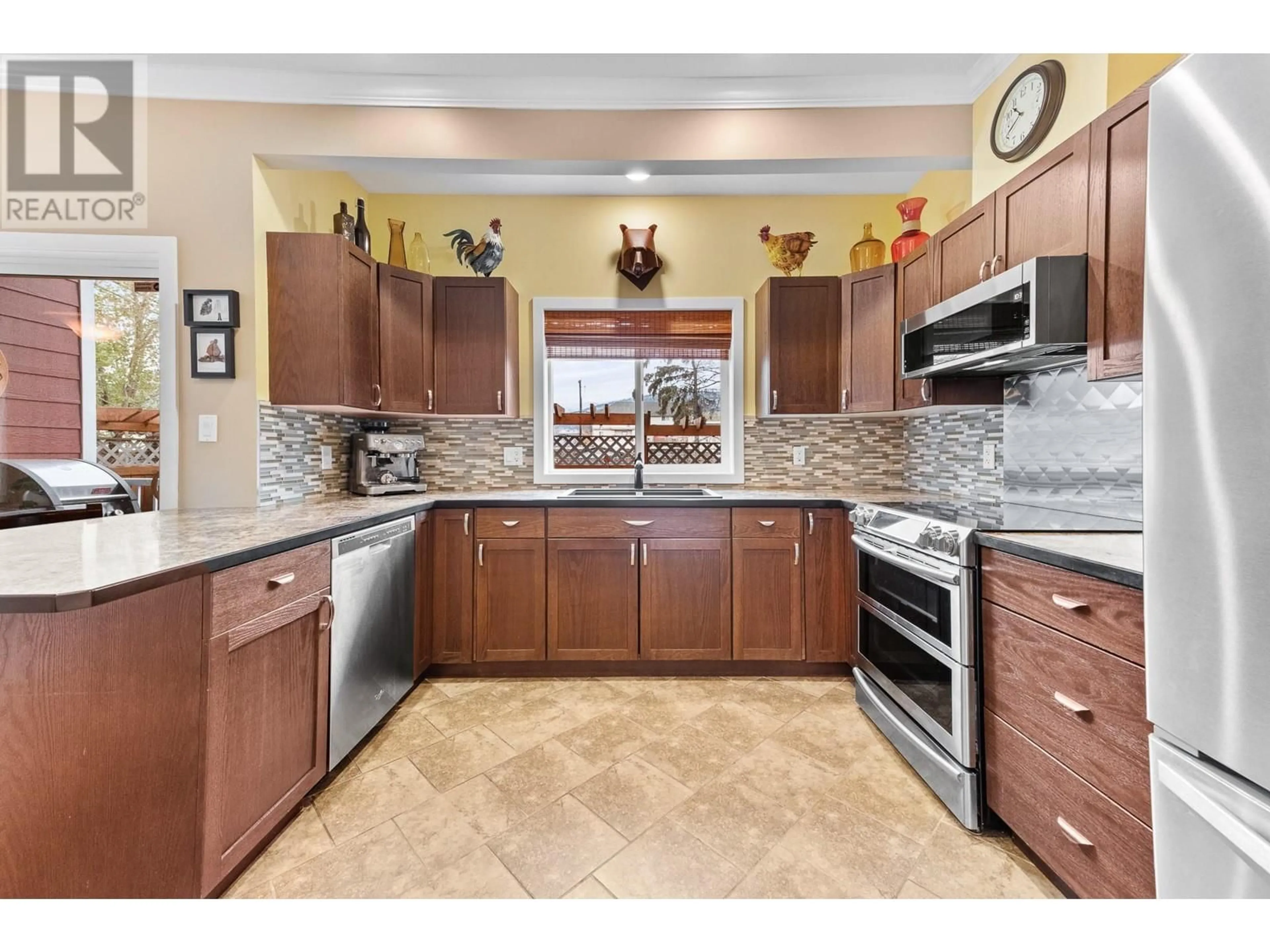 Open concept kitchen, ceramic/tile floor for 294 BASSETT Street, Penticton British Columbia V2A5W3