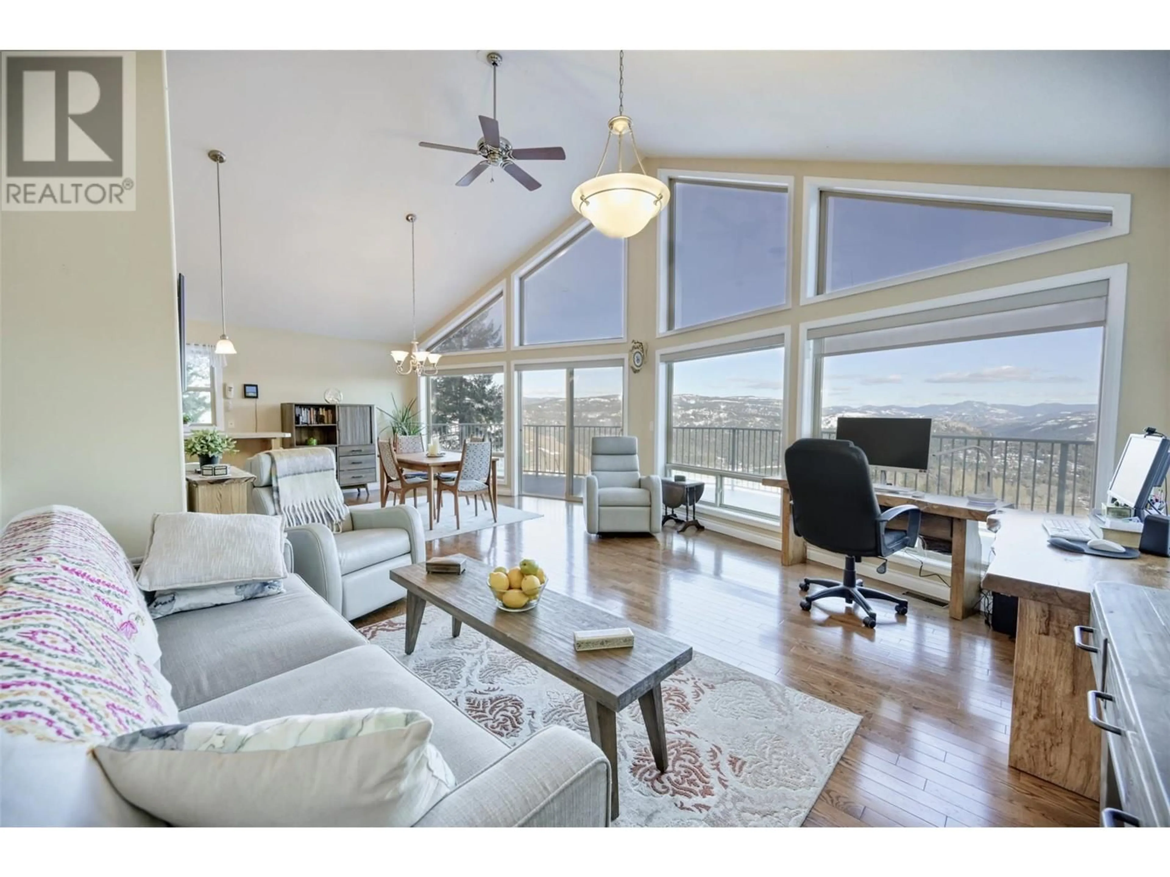 Living room with furniture, wood/laminate floor for 1835 HULME CREEK ROAD, Rock Creek British Columbia V0H1Y0