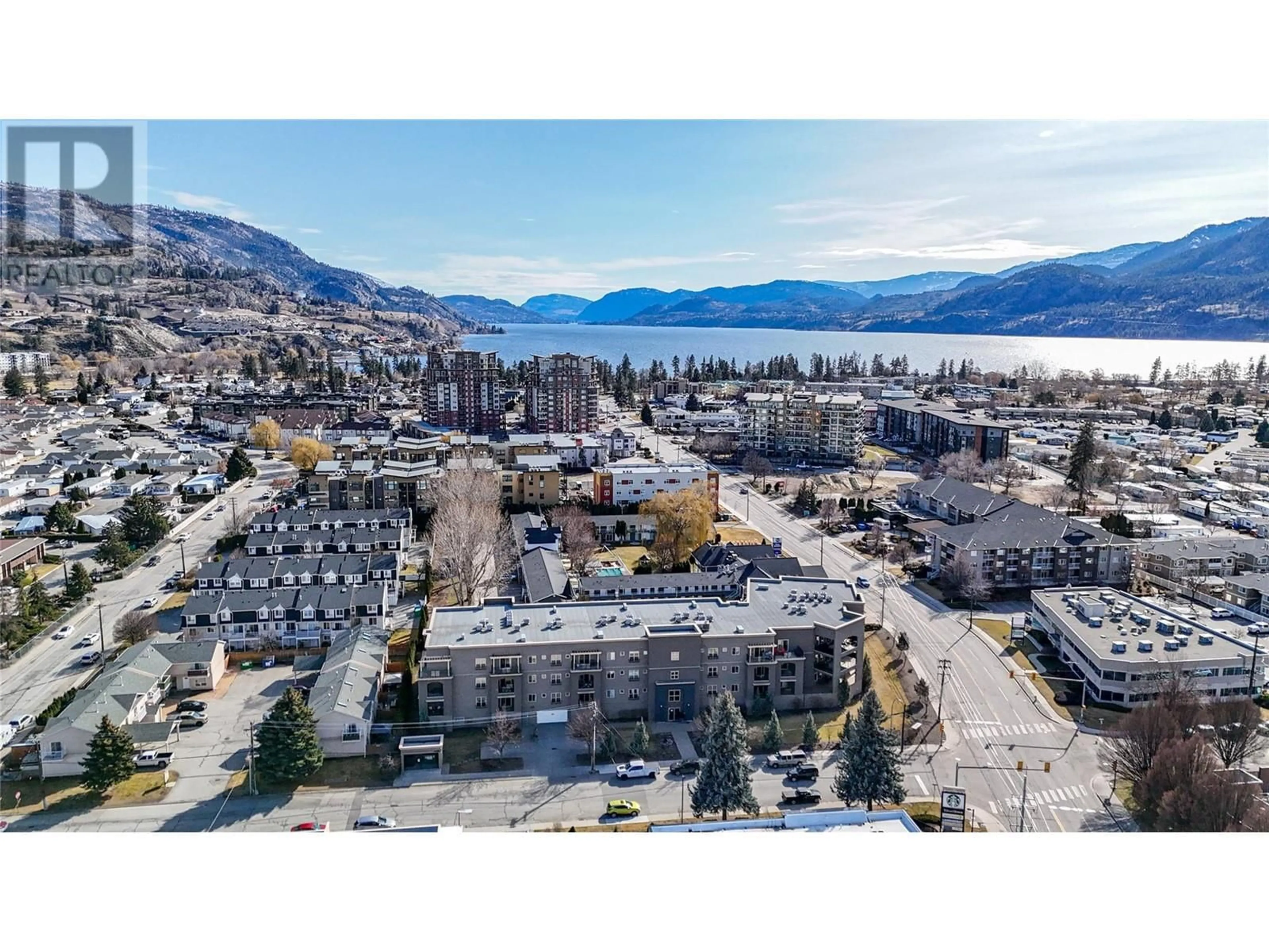 A pic from outside/outdoor area/front of a property/back of a property/a pic from drone, mountain view for 250 Waterford Avenue Unit# 208, Penticton British Columbia V2A3T8