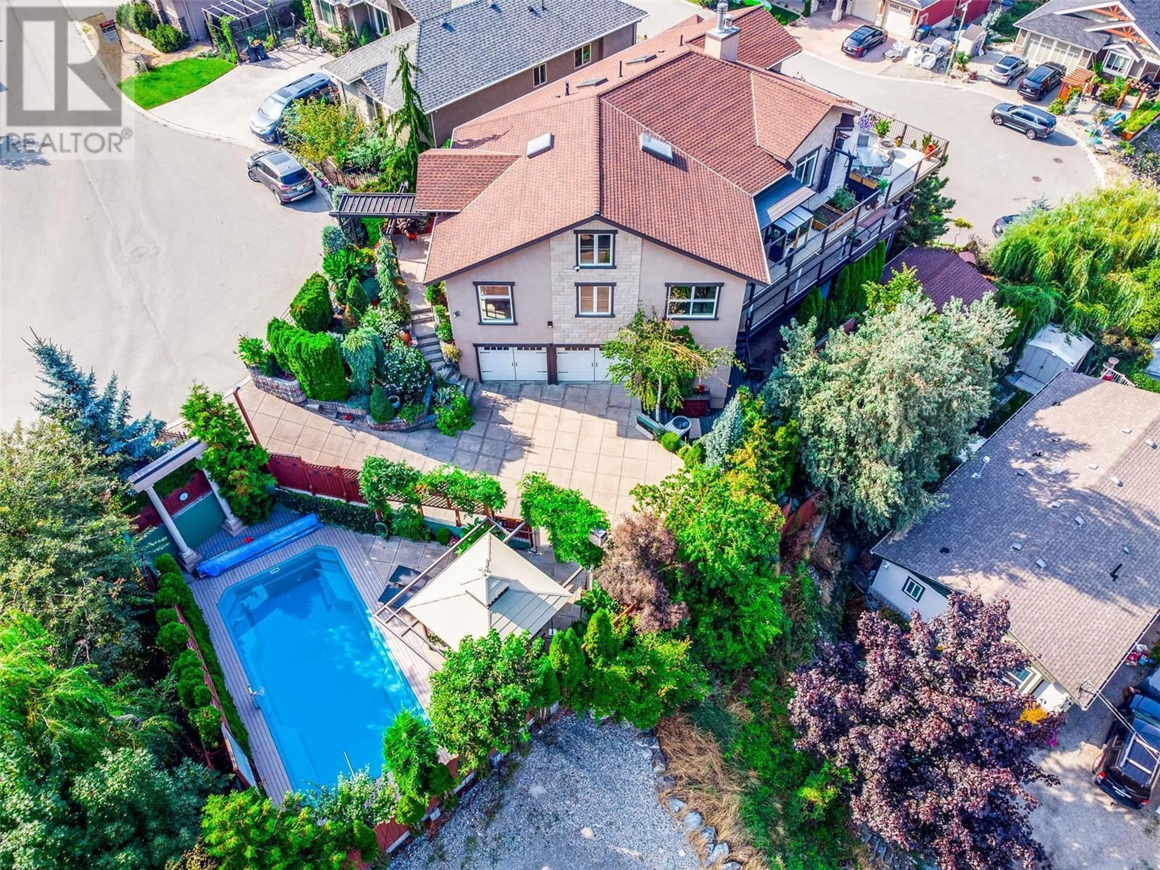 A pic from outside/outdoor area/front of a property/back of a property/a pic from drone, street for 375 Trumpeter Court, Kelowna British Columbia V1W5J4