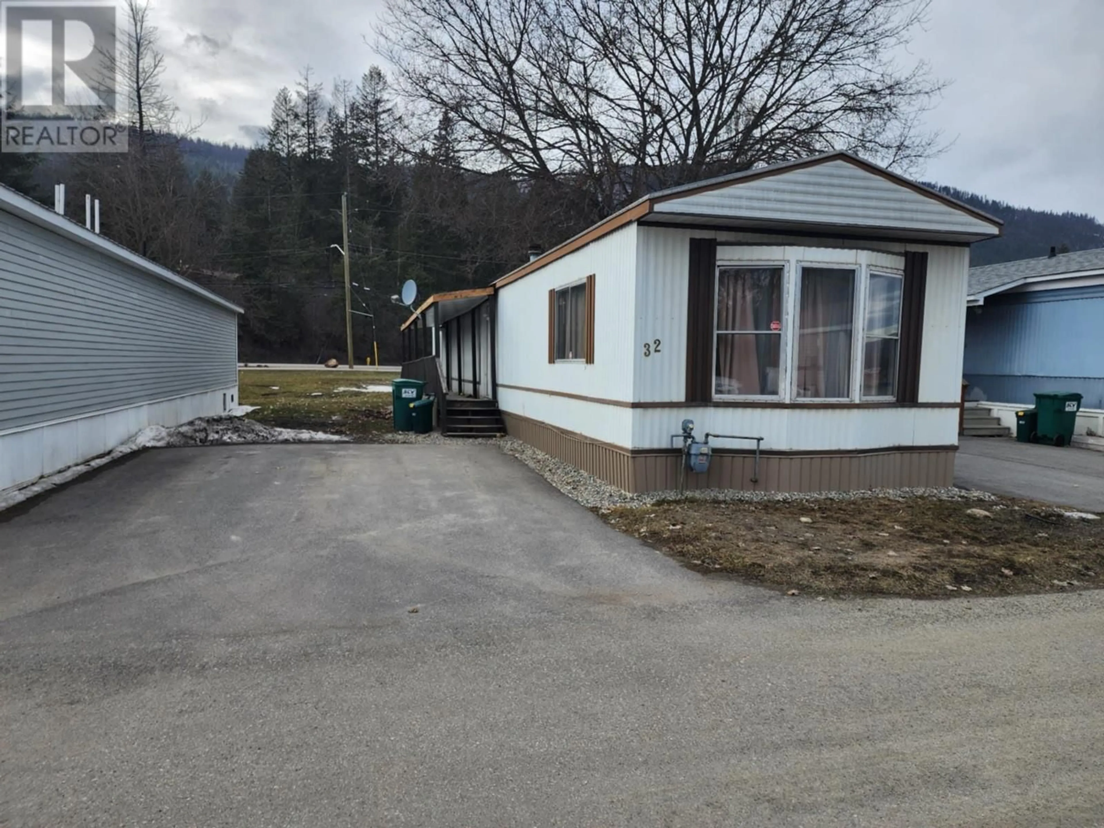 A pic from outside/outdoor area/front of a property/back of a property/a pic from drone, street for 2313 Shuswap Avenue Unit# 32, Lumby British Columbia V0E2G0