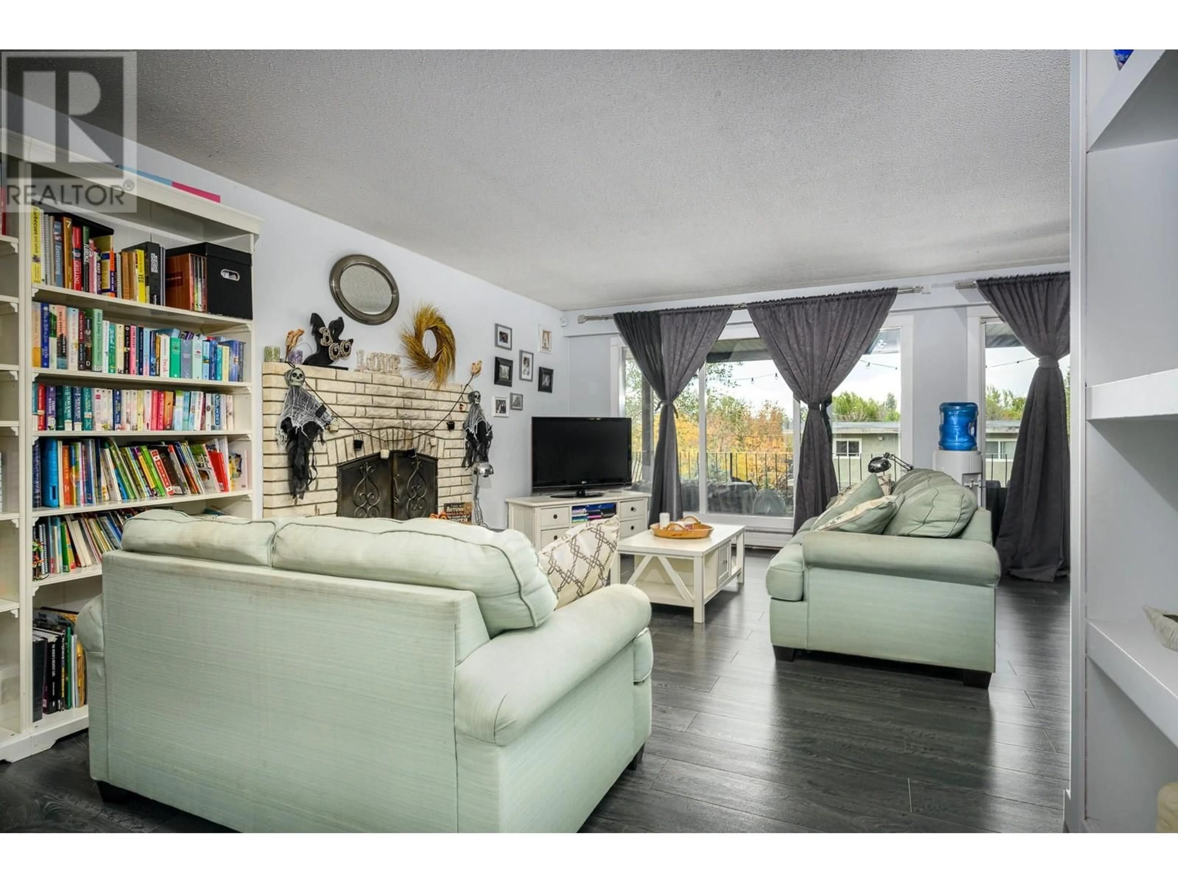 Living room with furniture, unknown for 4006 Pleasant Valley Road, Vernon British Columbia V1T4M2