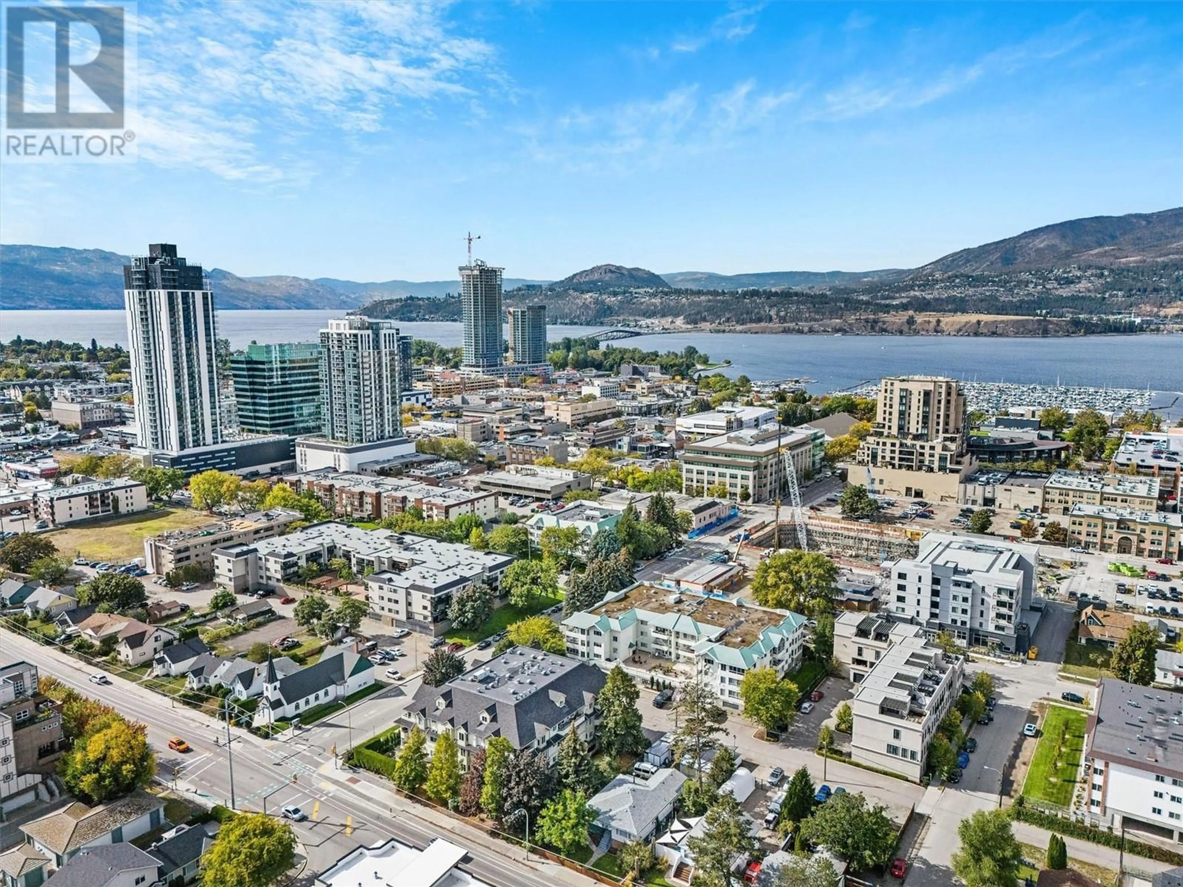 A pic from outside/outdoor area/front of a property/back of a property/a pic from drone, unknown for 306 - 680 DOYLE AVENUE, Kelowna British Columbia V1Y9S2