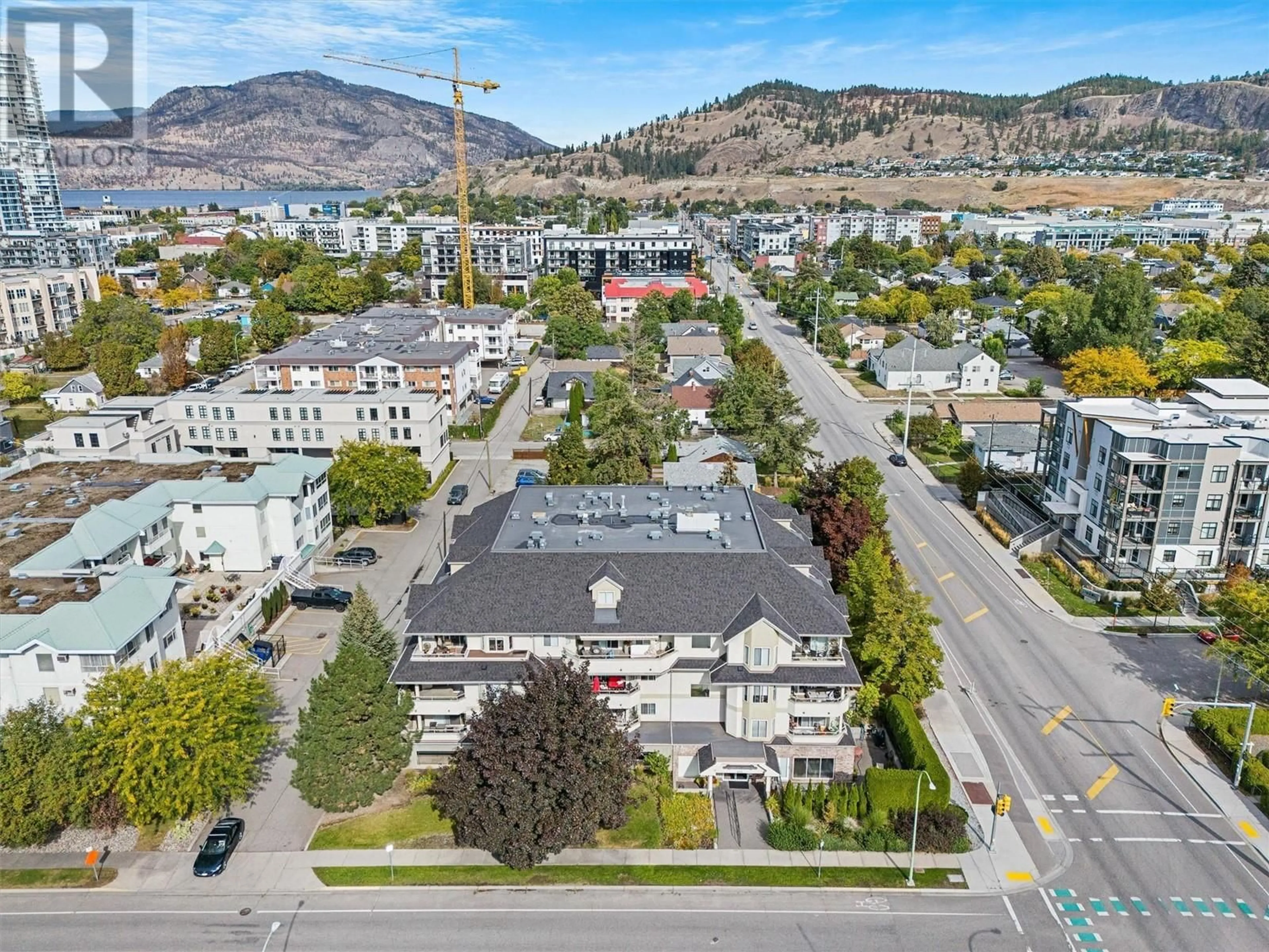 A pic from outside/outdoor area/front of a property/back of a property/a pic from drone, mountain view for 306 - 680 DOYLE AVENUE, Kelowna British Columbia V1Y9S2