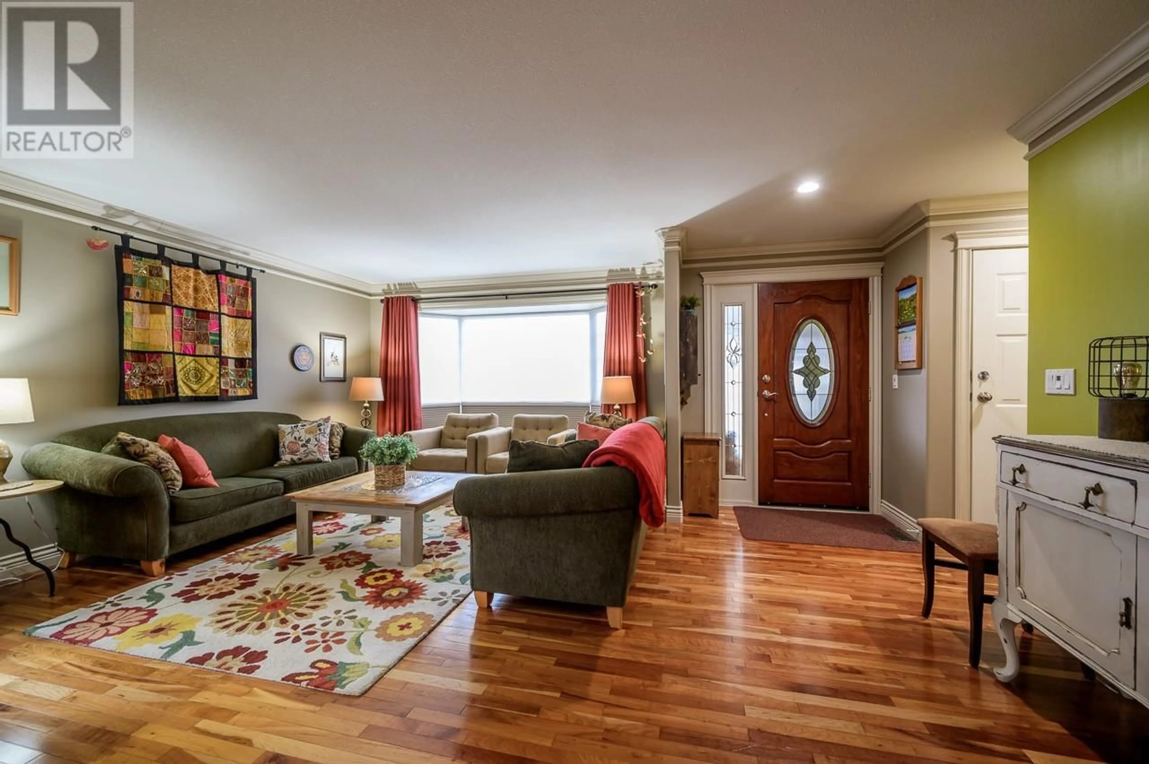 Living room with furniture, wood/laminate floor for 353 TUXFORD DRIVE, Kamloops British Columbia V2E2M7