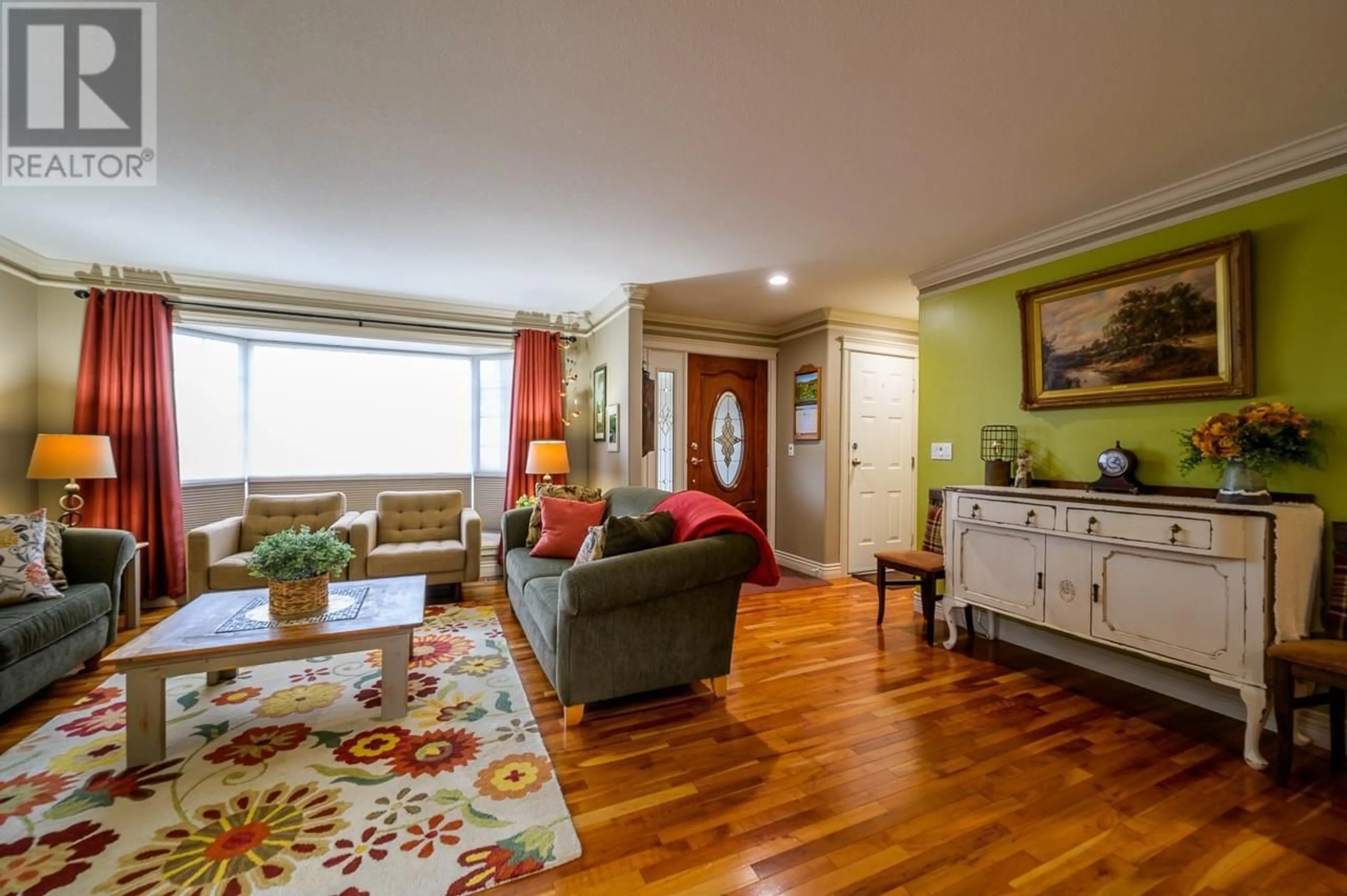 Living room with furniture, wood/laminate floor for 353 TUXFORD DRIVE, Kamloops British Columbia V2E2M7