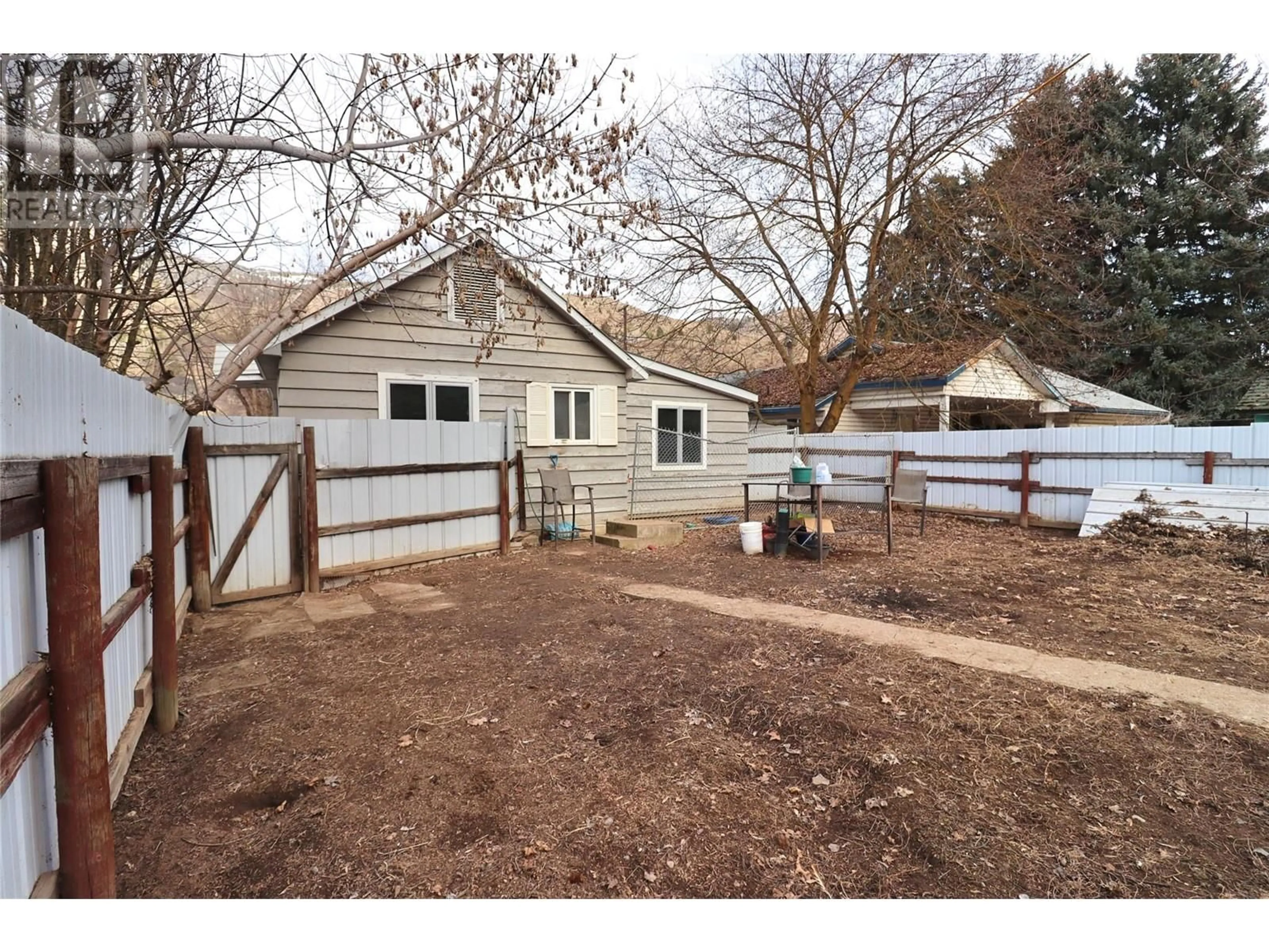 A pic from outside/outdoor area/front of a property/back of a property/a pic from drone, street for 8185 RIVERSIDE DRIVE, Grand Forks British Columbia V0H1H0