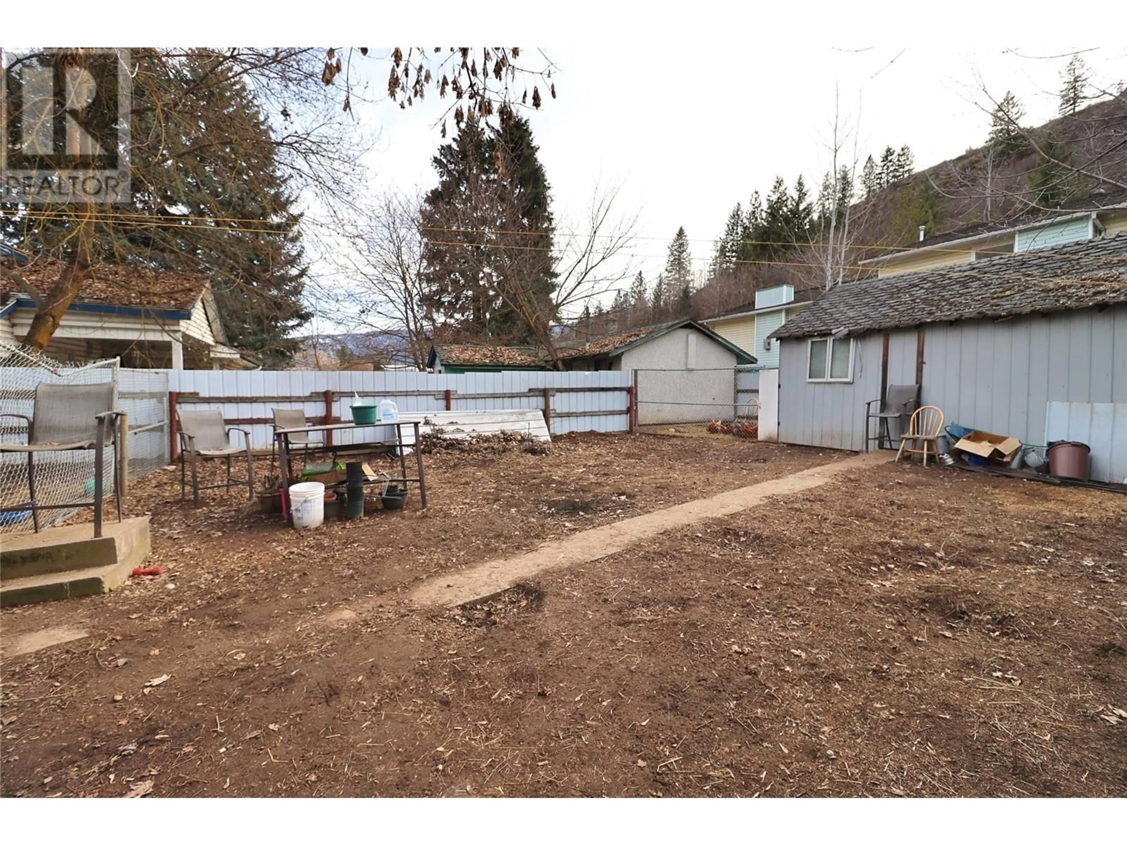 A pic from outside/outdoor area/front of a property/back of a property/a pic from drone, street for 8185 Riverside Drive, Grand Forks British Columbia V0H1H0