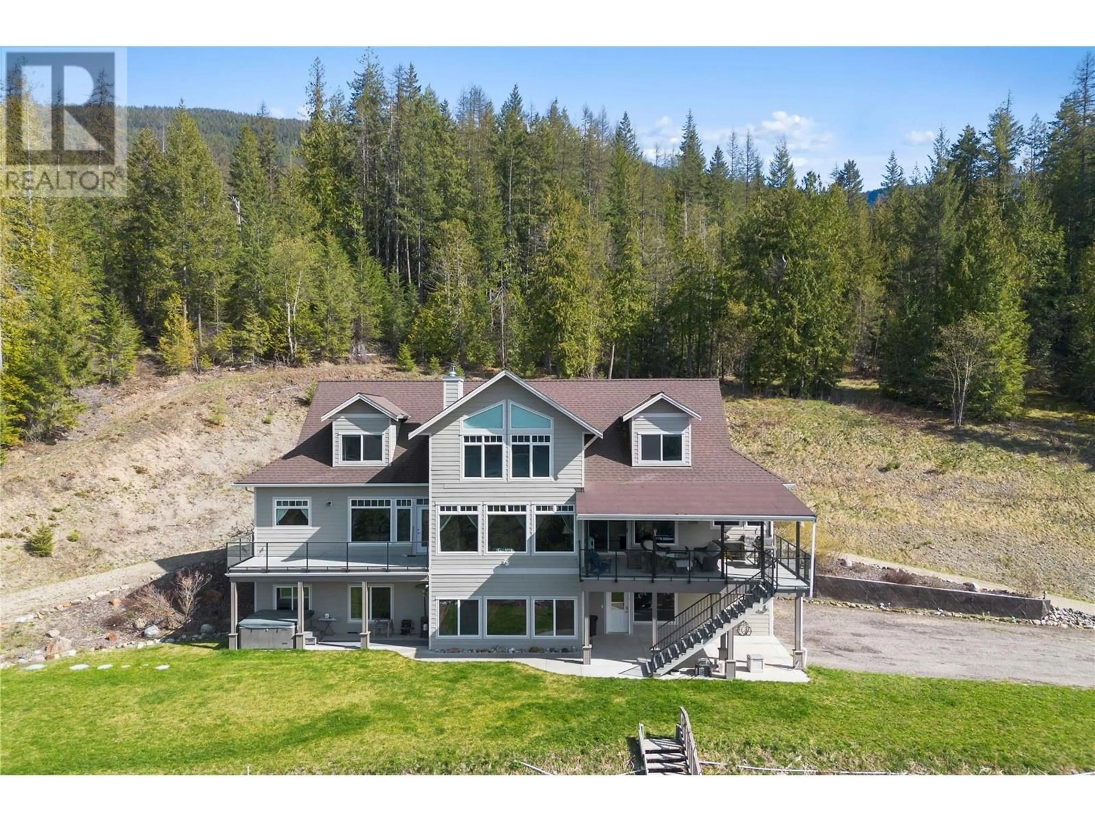 A pic from outside/outdoor area/front of a property/back of a property/a pic from drone, water/lake/river/ocean view for 8097 SEED ROAD, Mara British Columbia V0E2K0