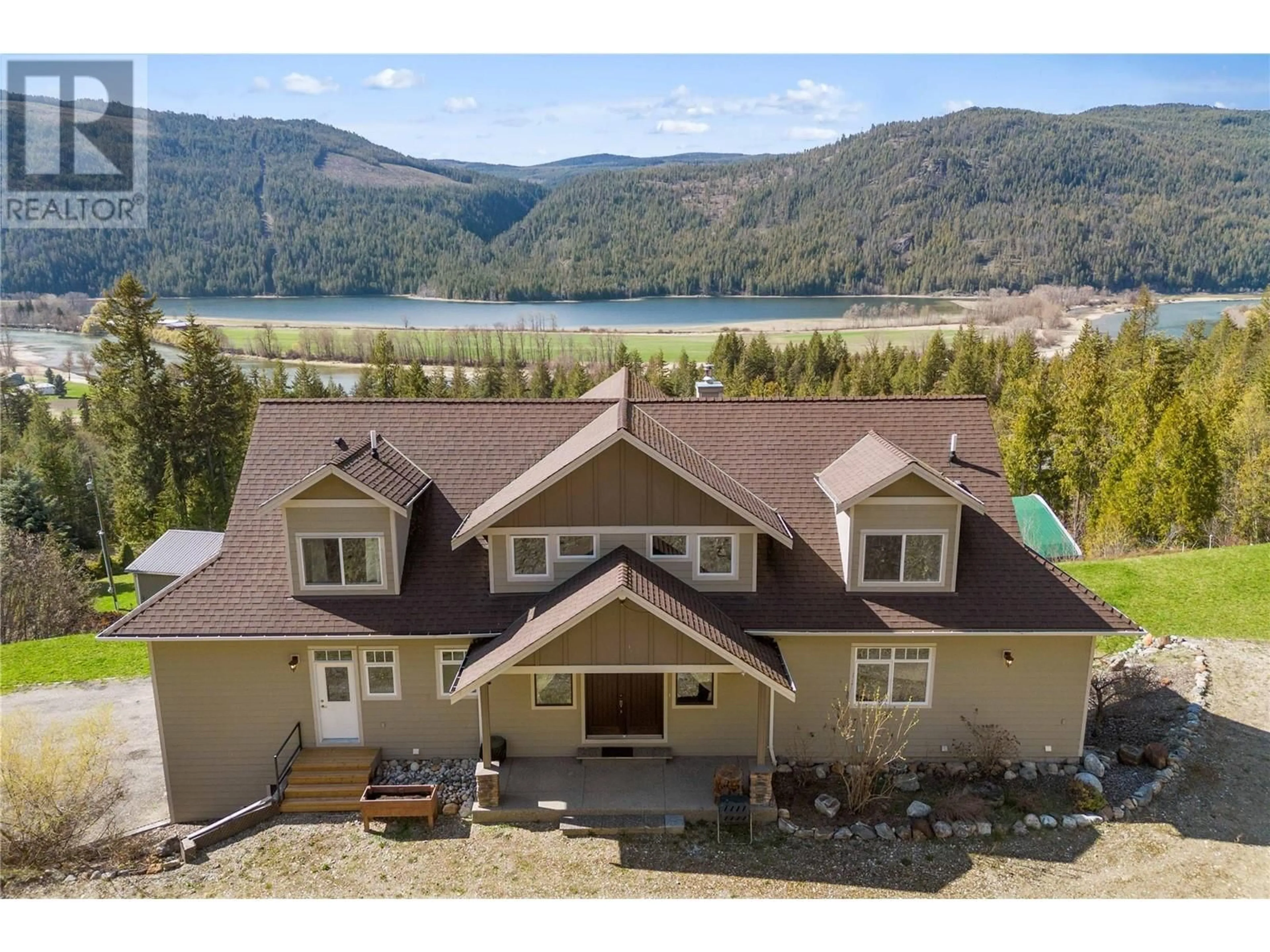 A pic from outside/outdoor area/front of a property/back of a property/a pic from drone, water/lake/river/ocean view for 8097 SEED ROAD, Mara British Columbia V0E2K0