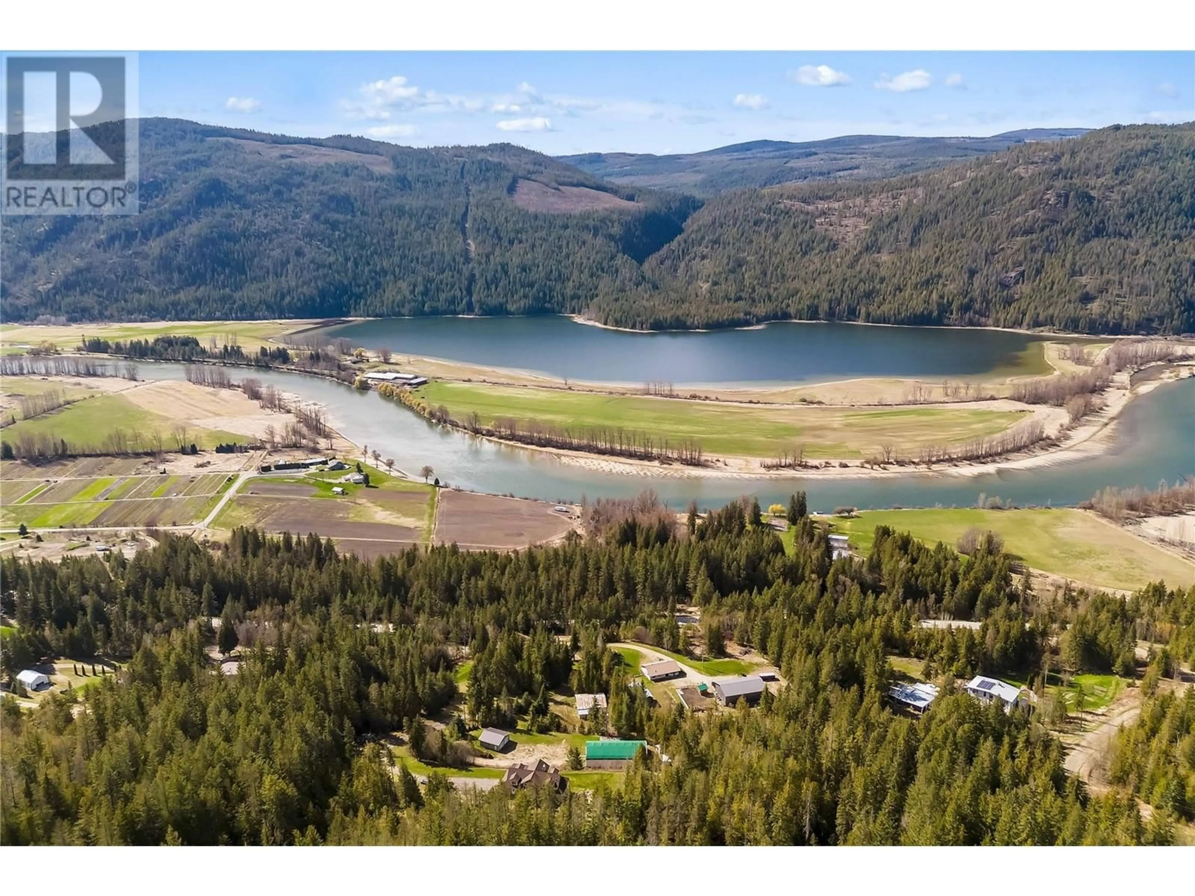 A pic from outside/outdoor area/front of a property/back of a property/a pic from drone, water/lake/river/ocean view for 8097 SEED ROAD, Mara British Columbia V0E2K0