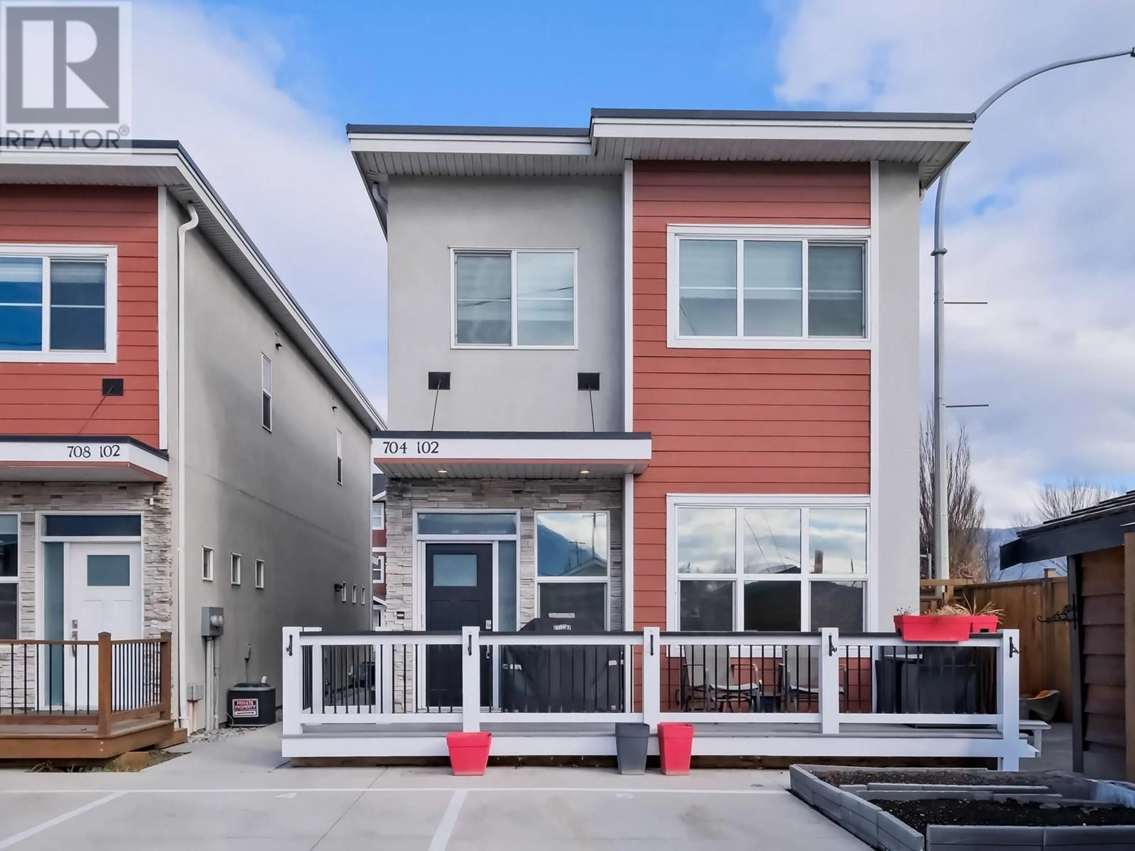 Home with vinyl exterior material, street for 704 REVELSTOKE Avenue Unit# 102, Penticton British Columbia V2A2J2