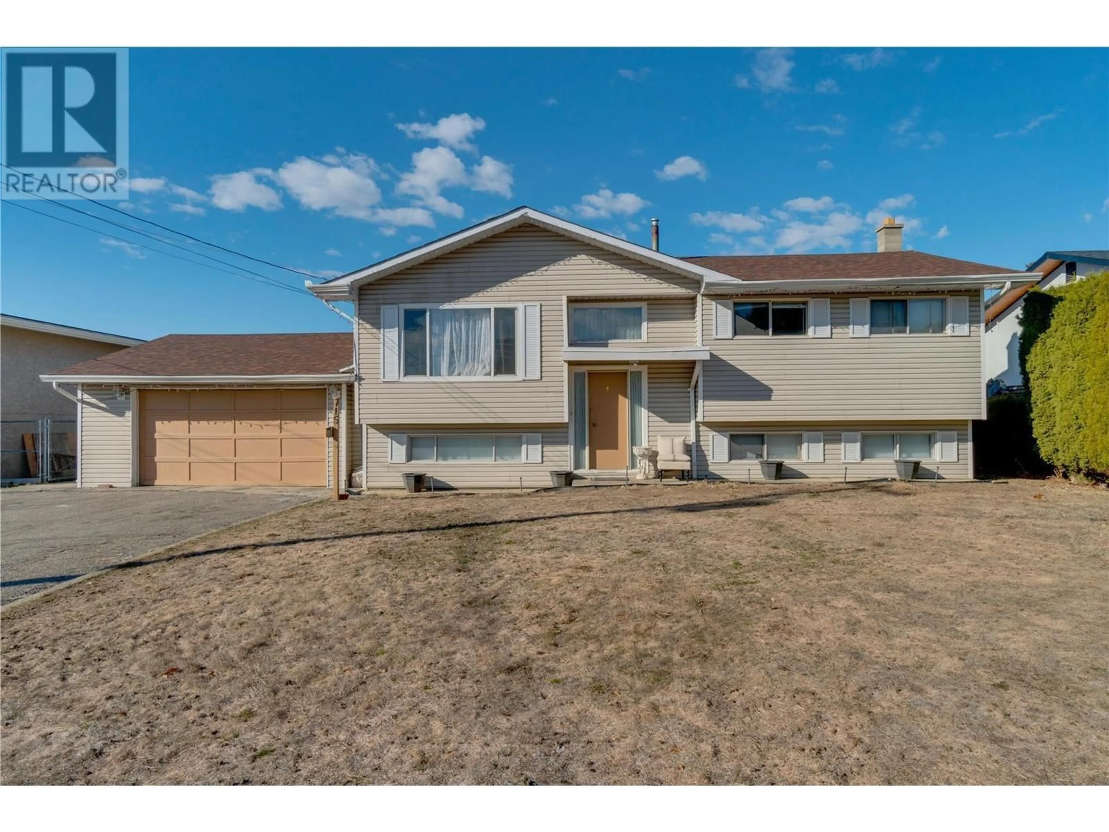 Home with vinyl exterior material, street for 715 CAMELIA ROAD, Kelowna British Columbia V1X3M9