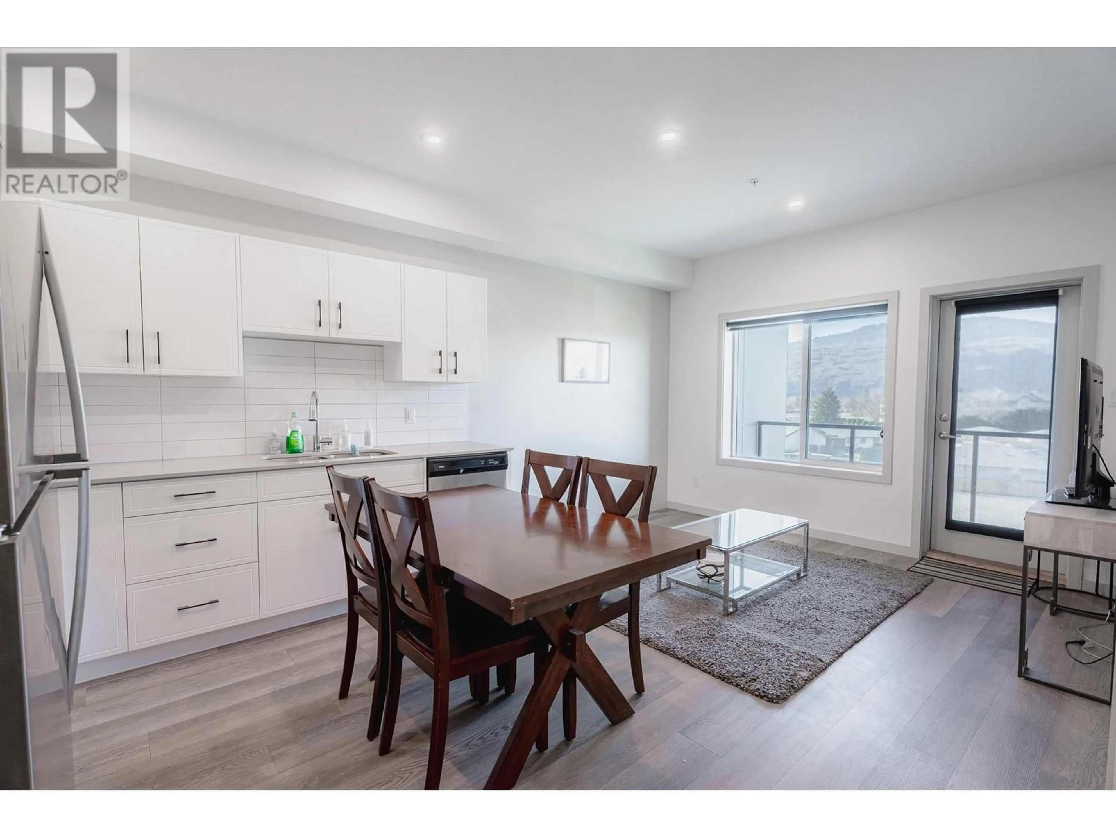 Open concept kitchen, wood/laminate floor for 766 TRANQUILLE Road Unit# 404, Kamloops British Columbia V2B3J2