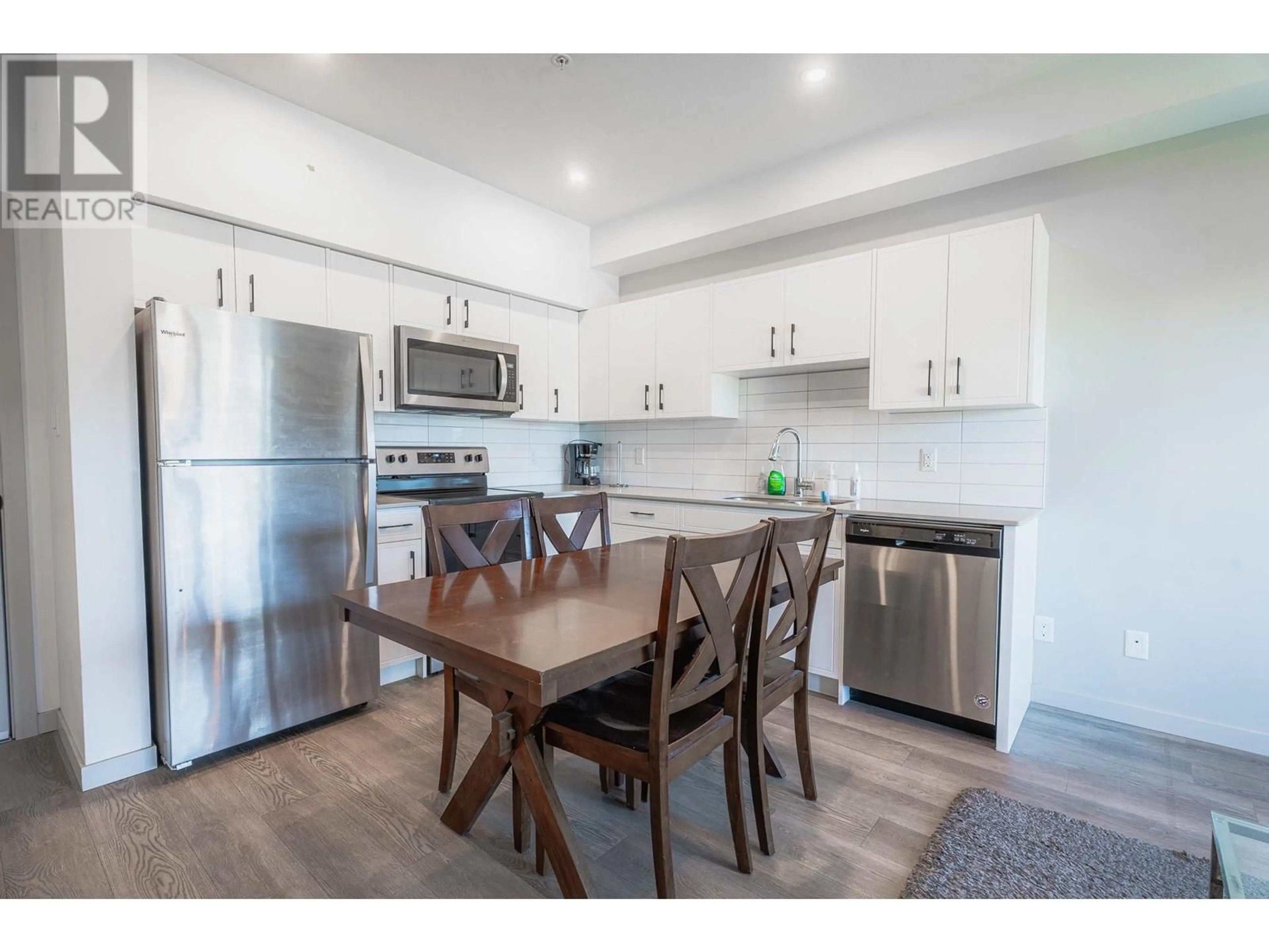 Open concept kitchen, wood/laminate floor for 766 TRANQUILLE Road Unit# 404, Kamloops British Columbia V2B3J2