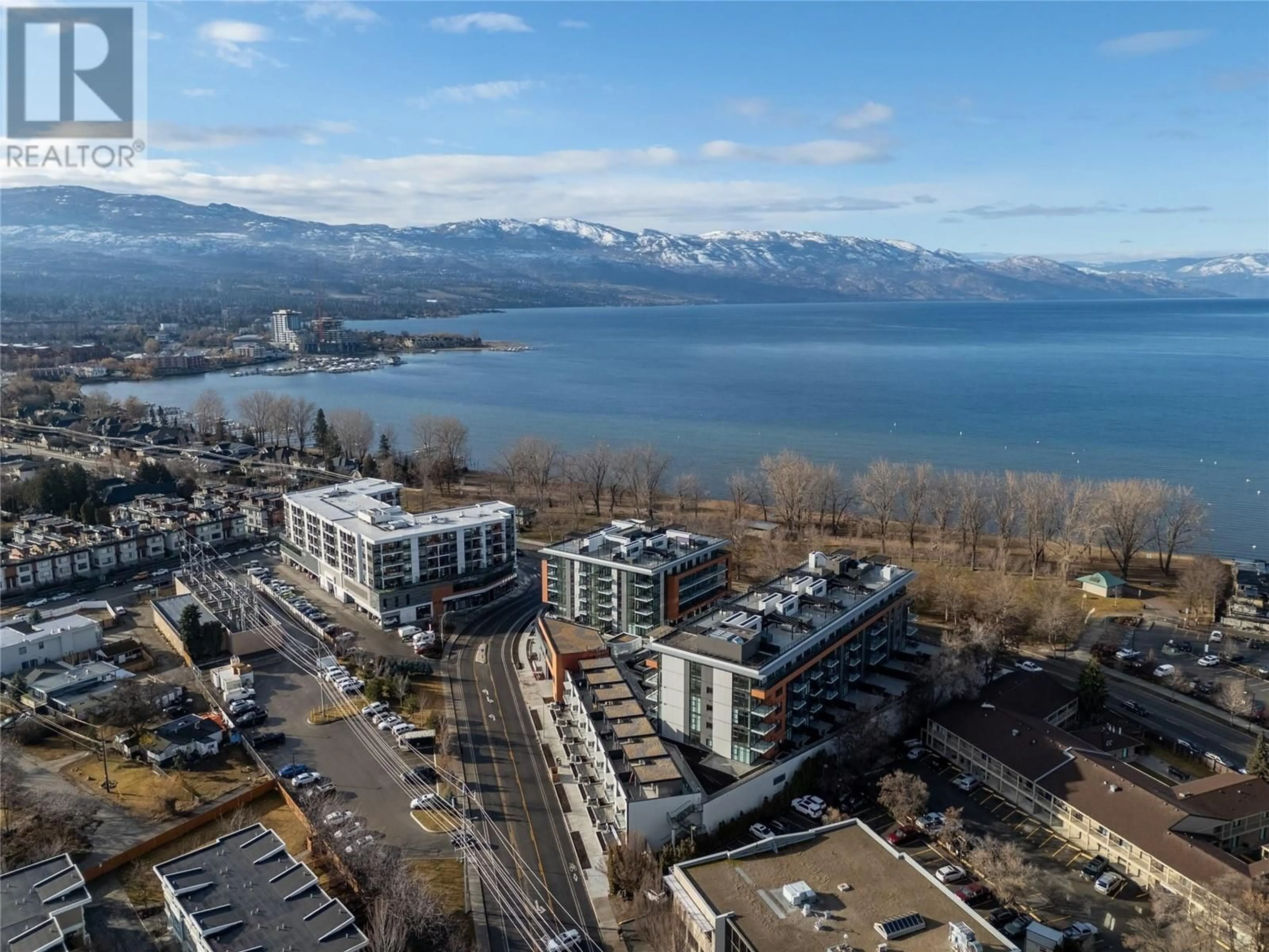 A pic from outside/outdoor area/front of a property/back of a property/a pic from drone, mountain view for S308 - 3409 LAKESHORE ROAD, Kelowna British Columbia V1W0G6