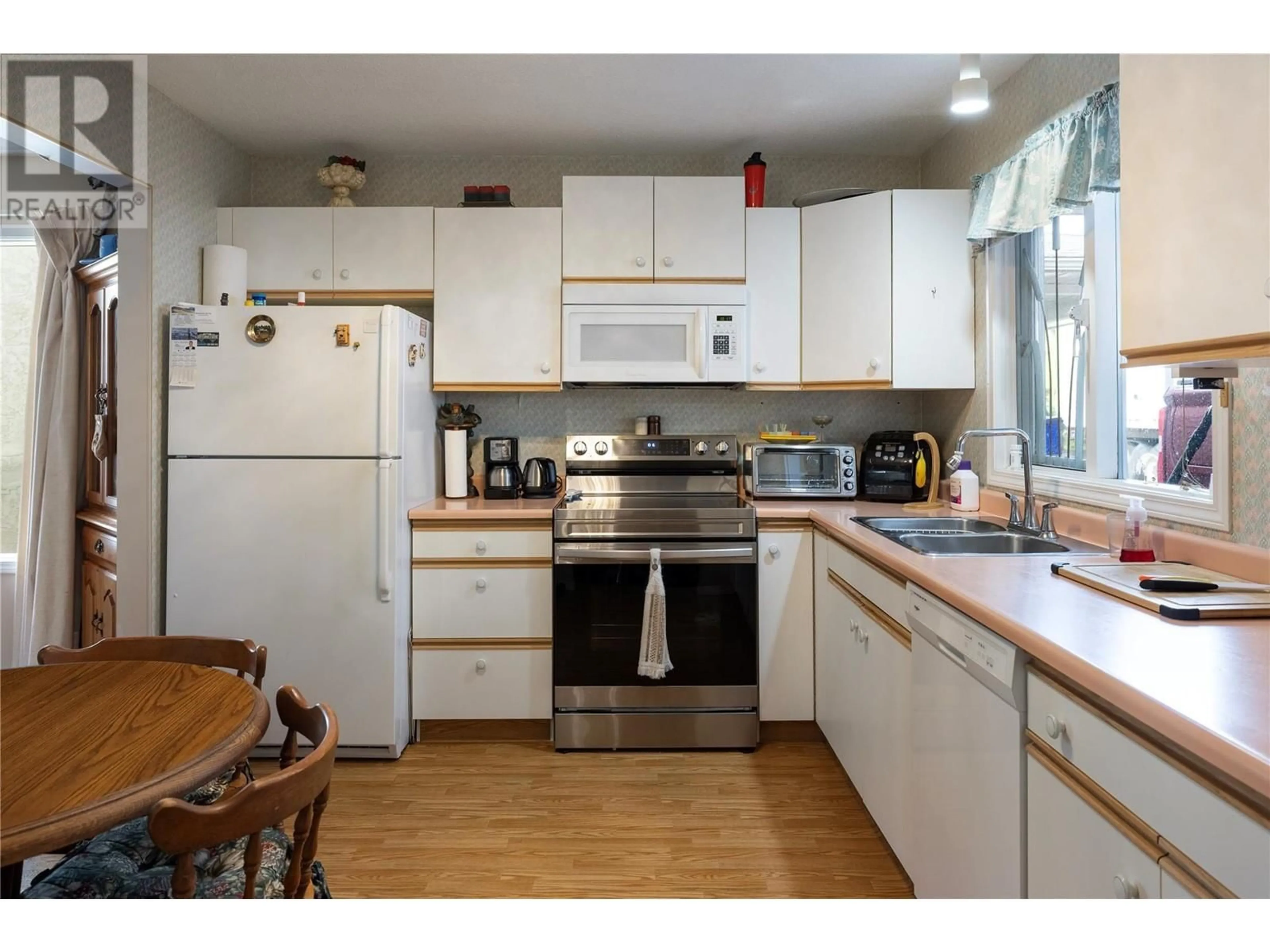 Standard kitchen, wood/laminate floor for 3900 27 Avenue Unit# 16, Vernon British Columbia V1T9E6