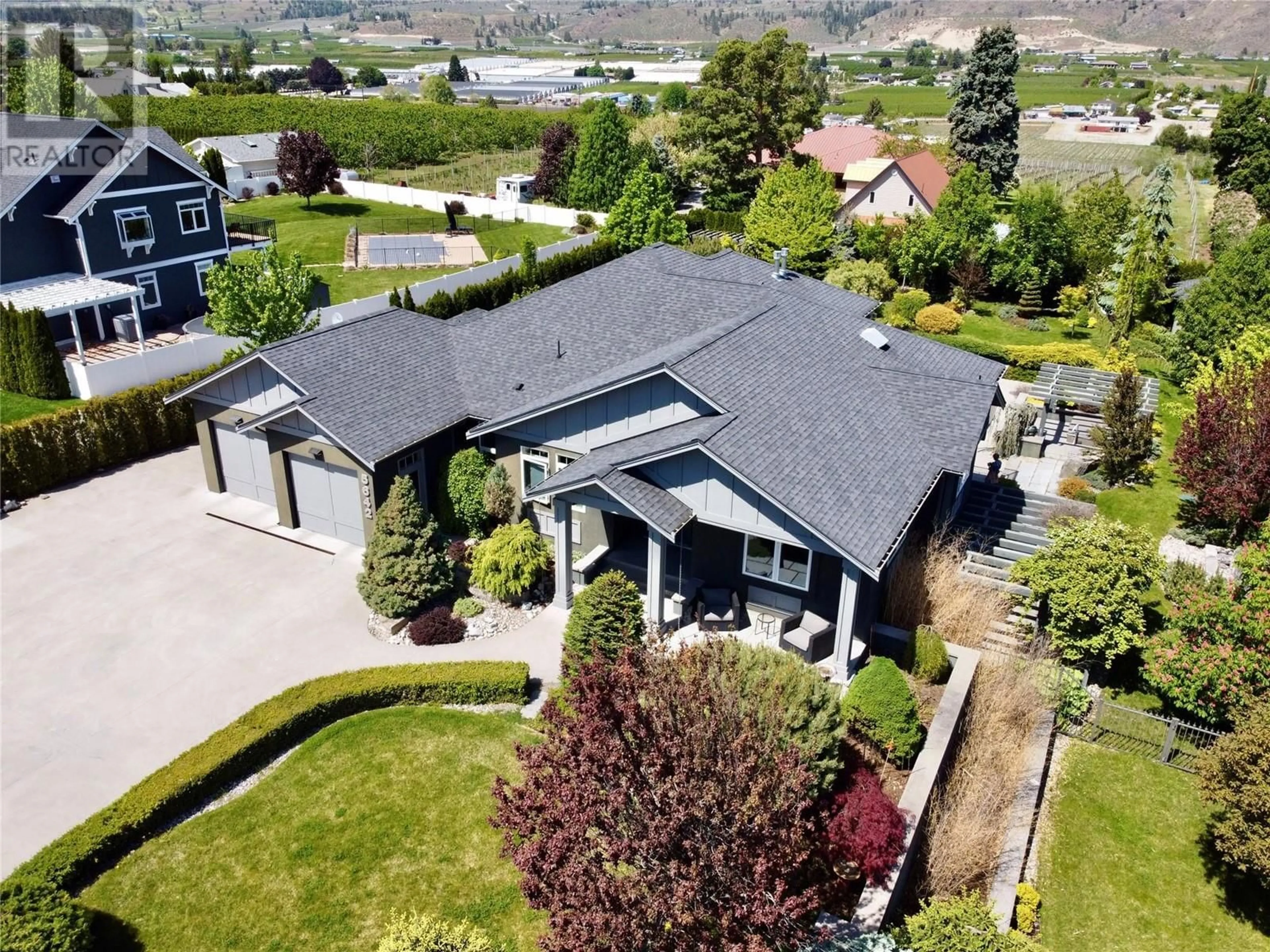A pic from outside/outdoor area/front of a property/back of a property/a pic from drone, mountain view for 5642 YARROW STREET, Oliver British Columbia V0H1T0