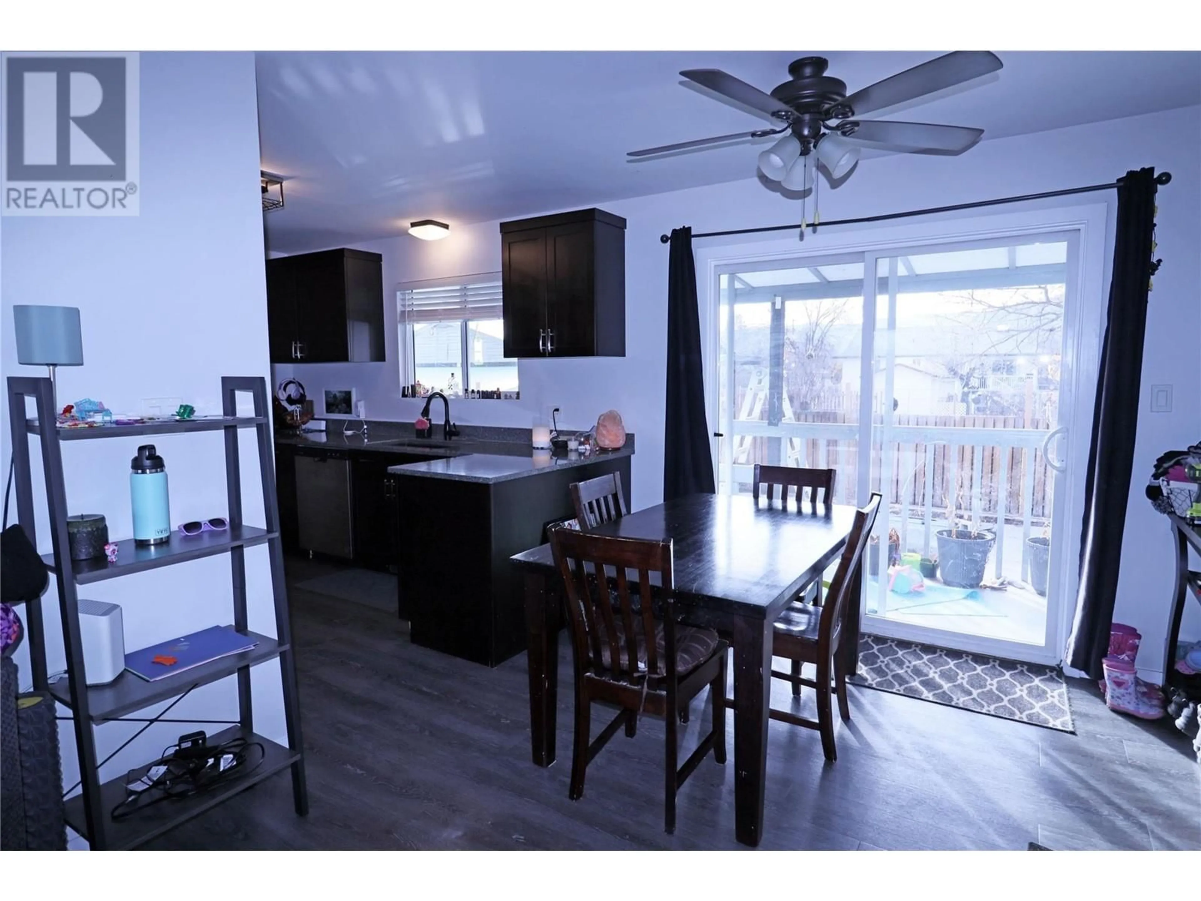 Open concept kitchen, wood/laminate floor for 6629 Kettle River Drive, Grand Forks British Columbia V0H1H2