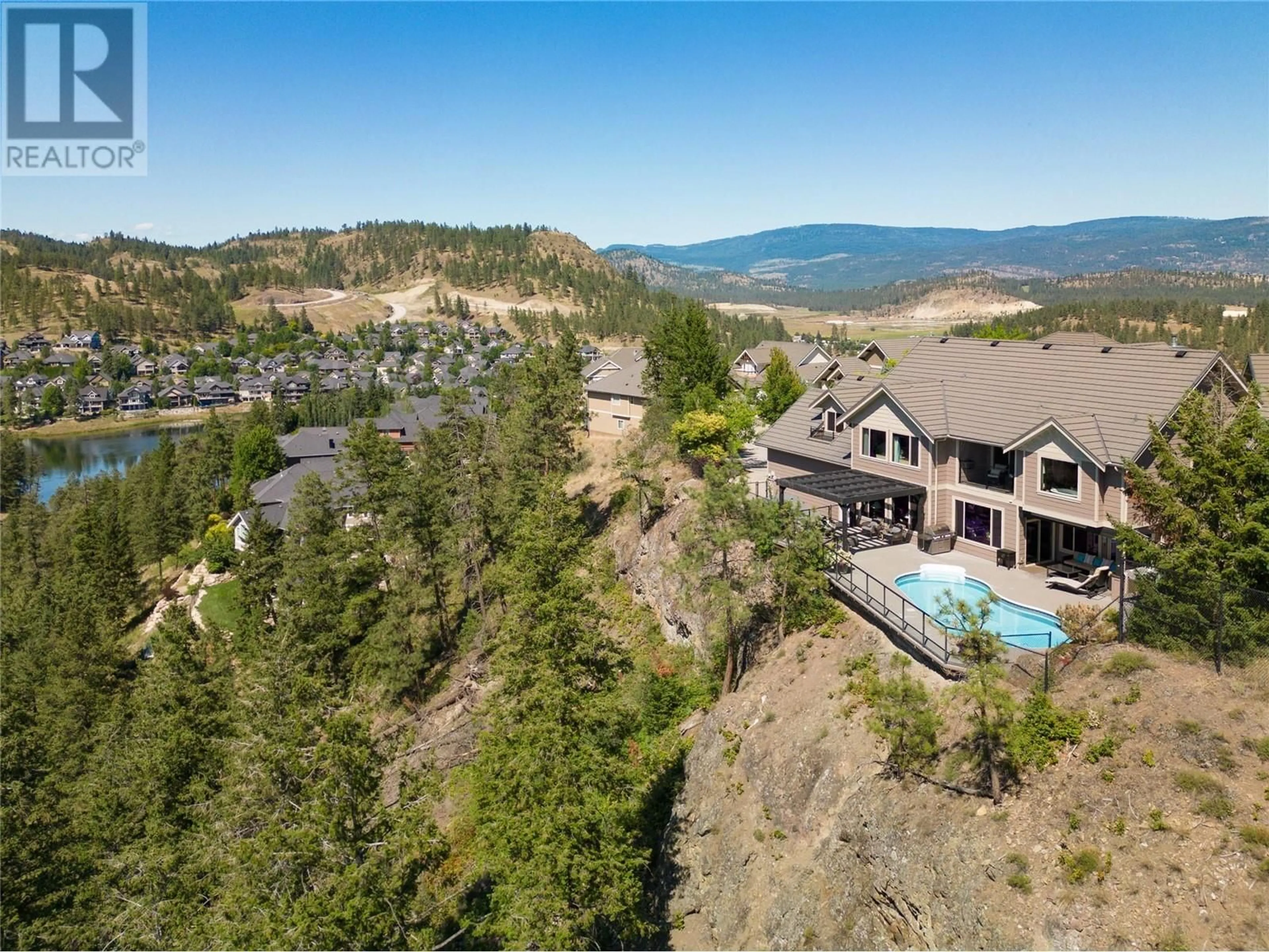 A pic from outside/outdoor area/front of a property/back of a property/a pic from drone, mountain view for 854 Big Rock Court, Kelowna British Columbia V1V2S1