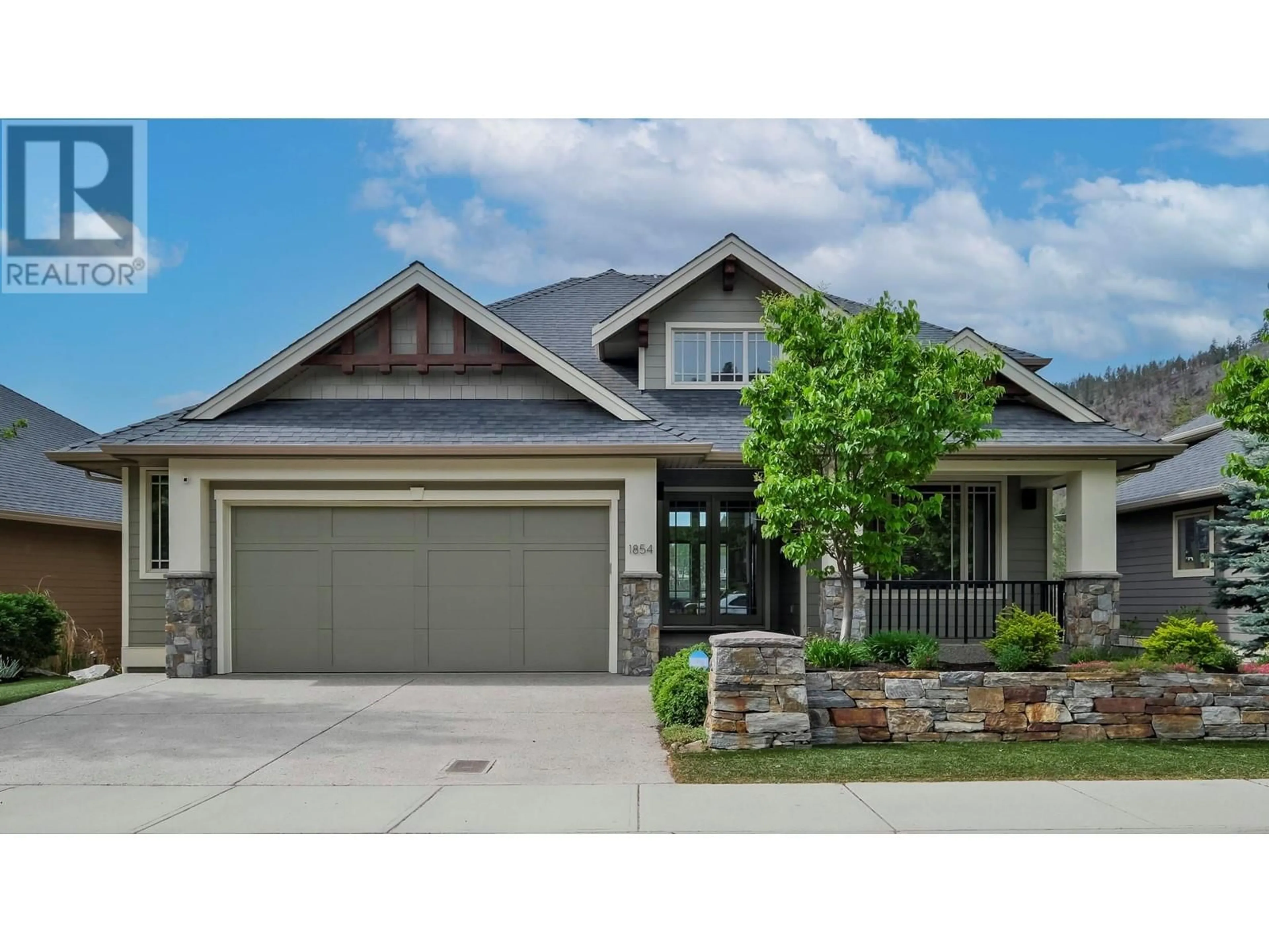 Home with brick exterior material, street for 1854 Hidden Lake Place, Kelowna British Columbia V1V2W8