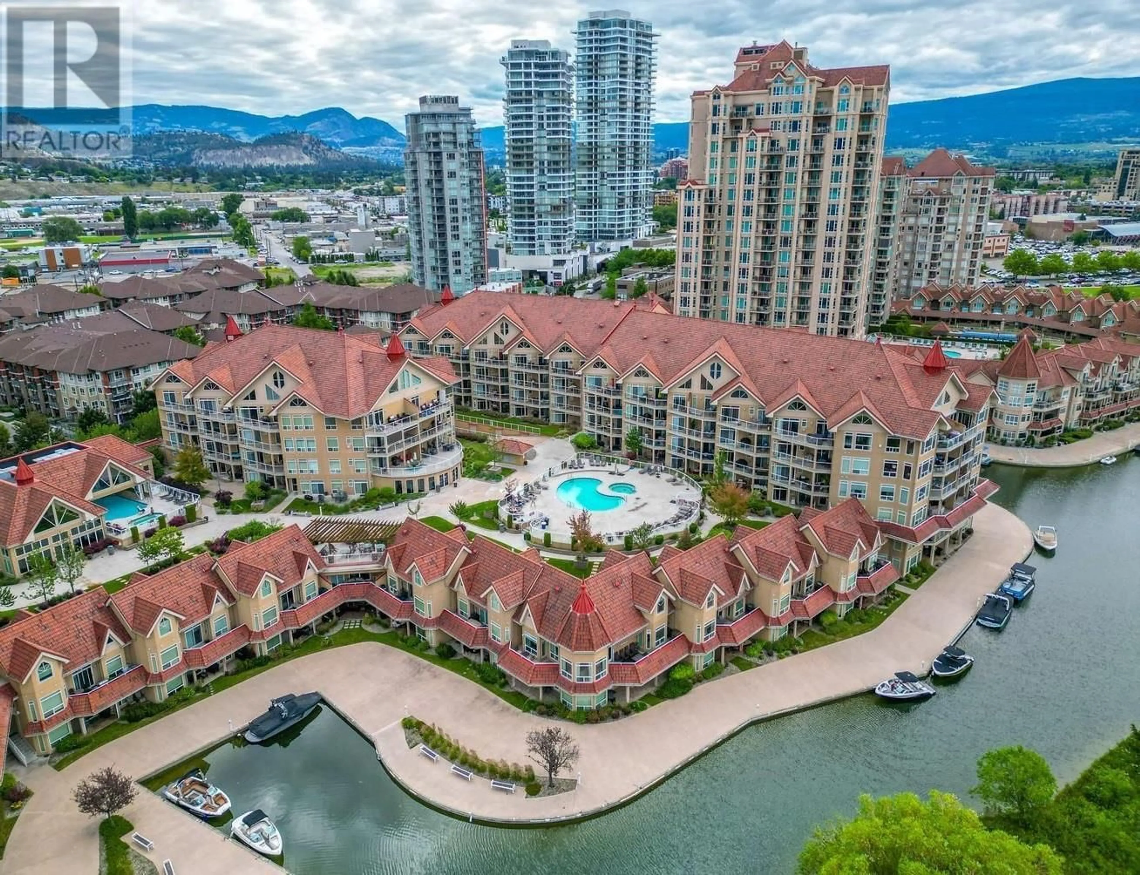 A pic from outside/outdoor area/front of a property/back of a property/a pic from drone, water/lake/river/ocean view for 221 - 1088 SUNSET DRIVE, Kelowna British Columbia V1Y9W1
