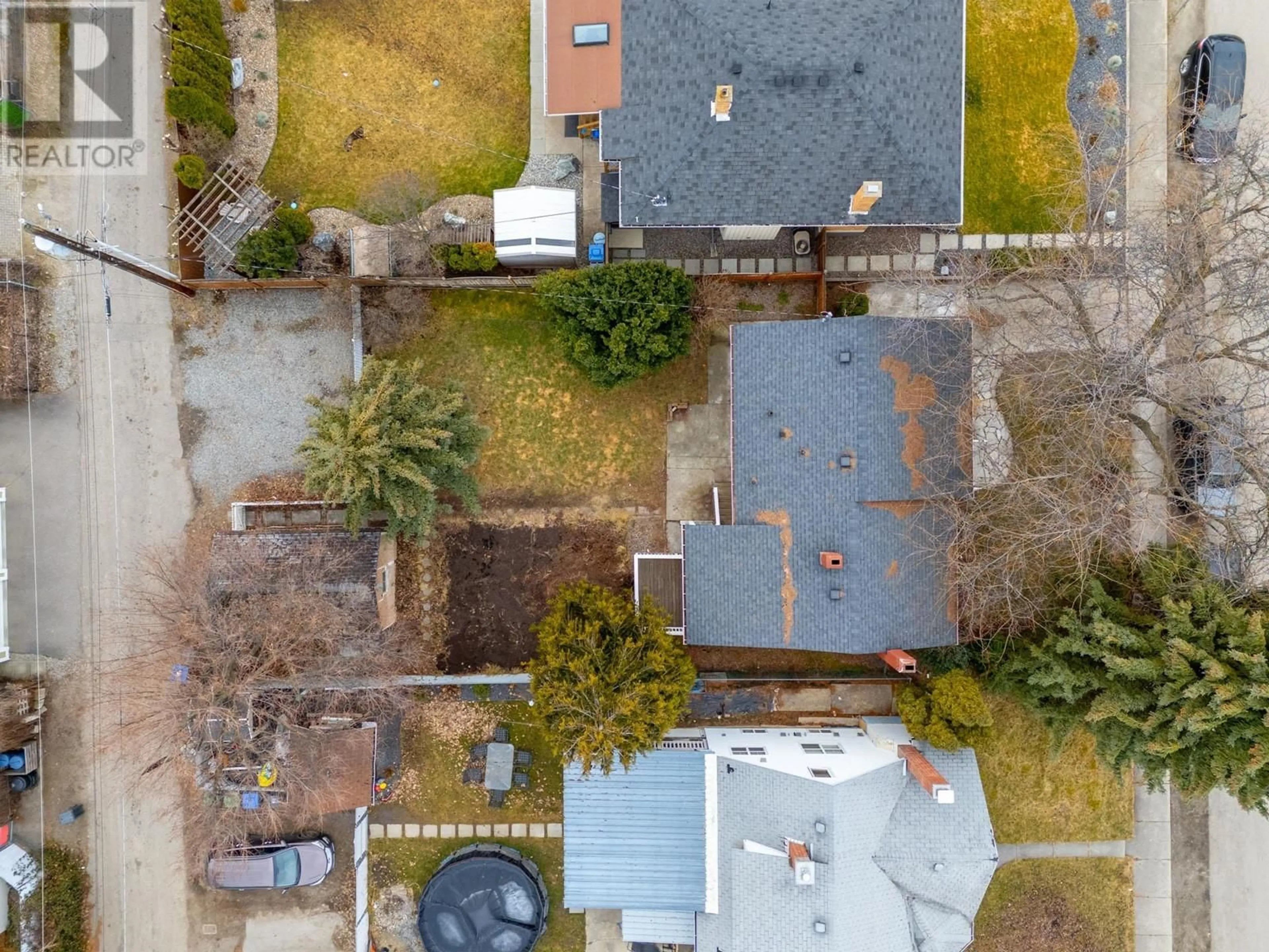 A pic from outside/outdoor area/front of a property/back of a property/a pic from drone, street for 1935 Carruthers Street, Kelowna British Columbia V1Y3B7