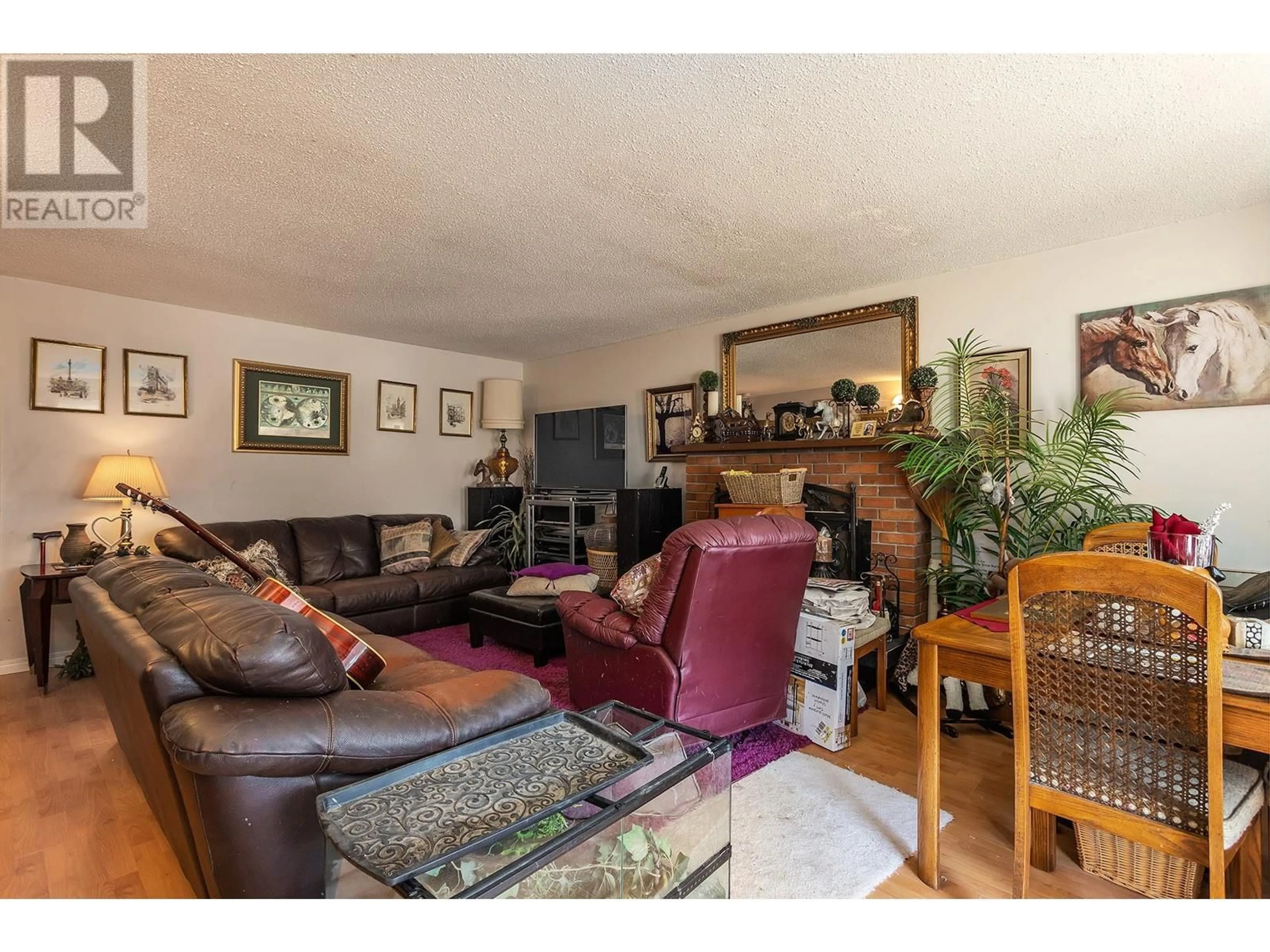 Living room with furniture, wood/laminate floor for 3343 McMorland Road, West Kelowna British Columbia V4T1B1