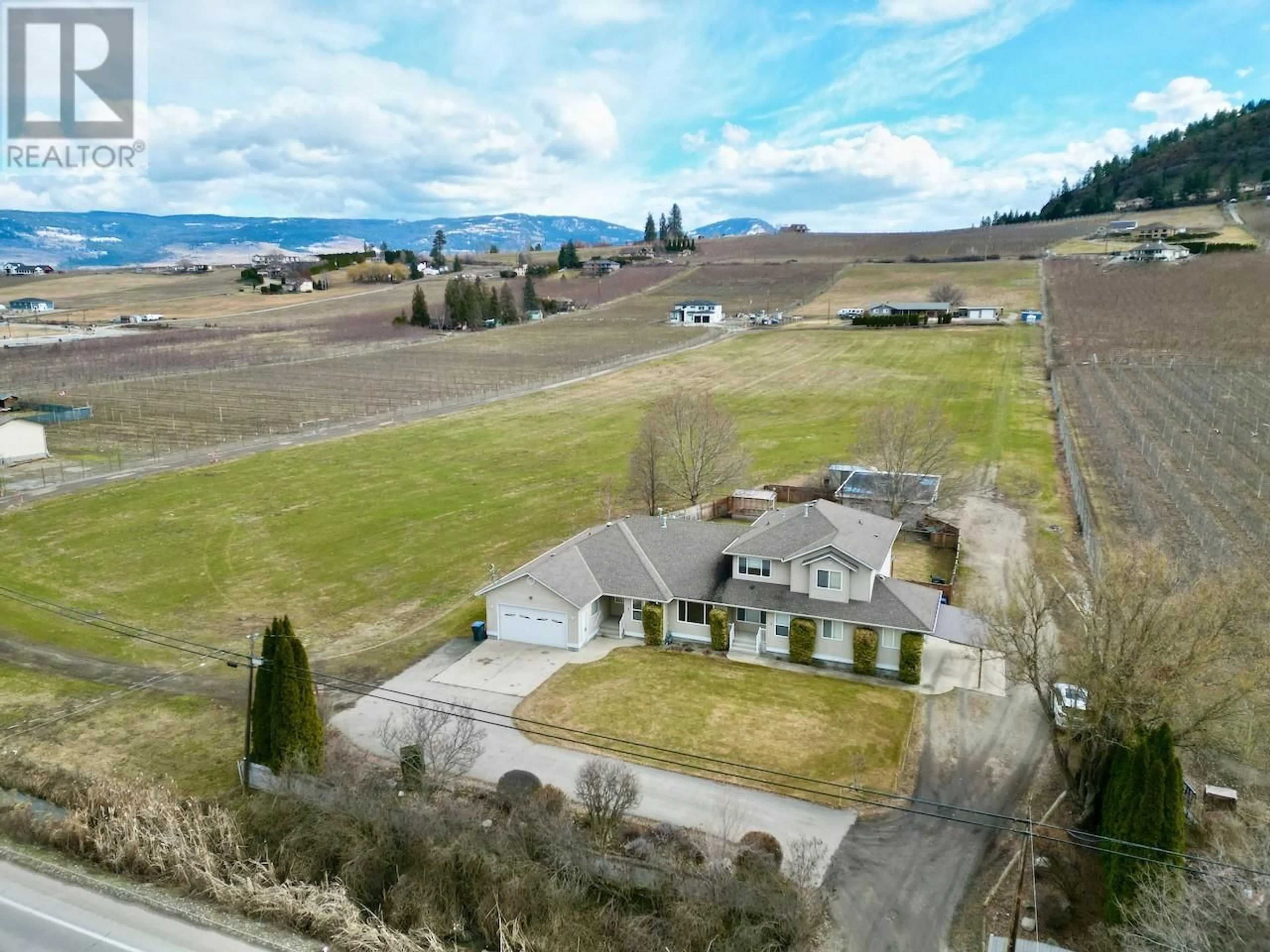 A pic from outside/outdoor area/front of a property/back of a property/a pic from drone, mountain view for 1-3 - 371 VALLEY ROAD, Kelowna British Columbia V1V2E5