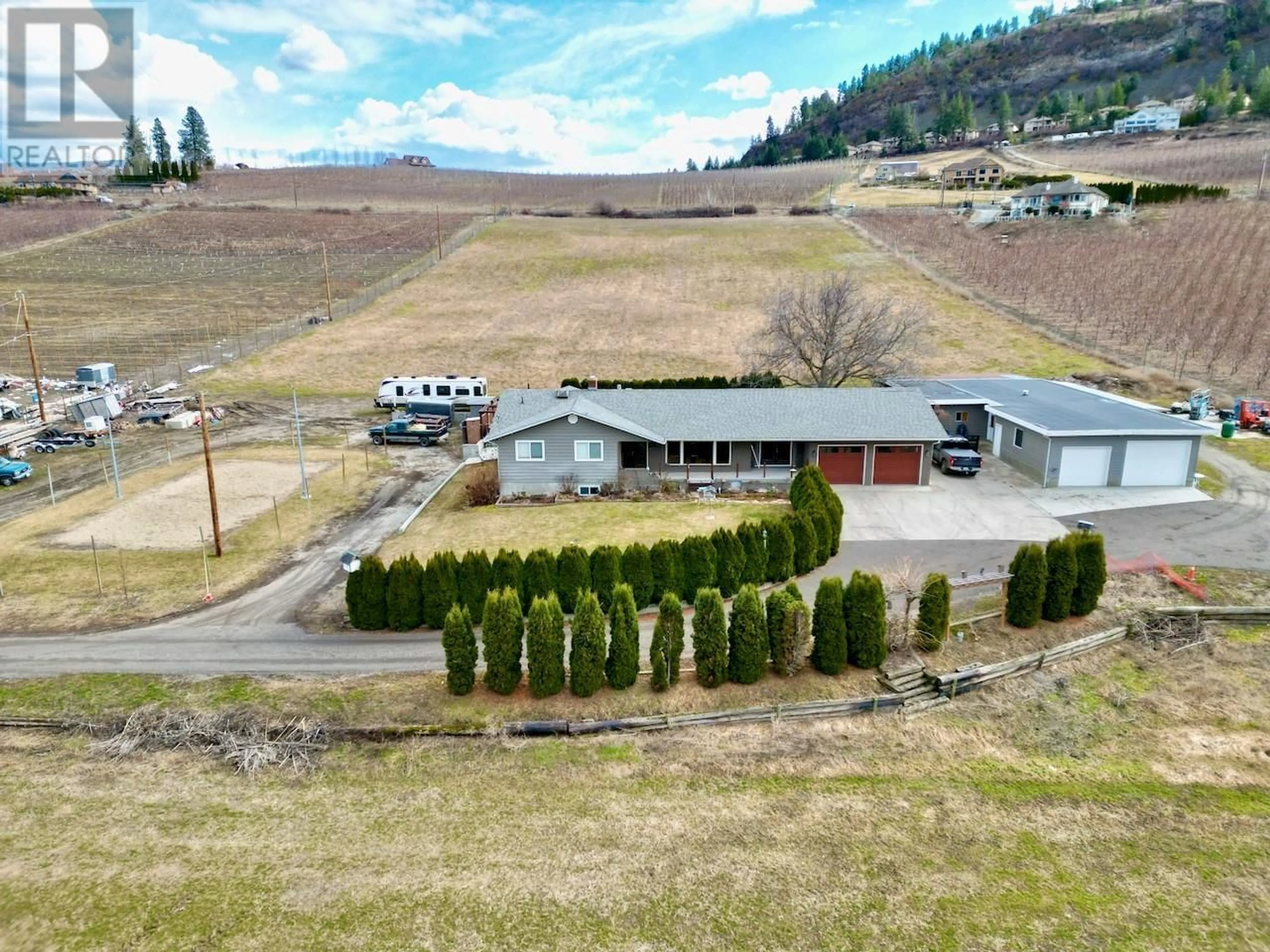 A pic from outside/outdoor area/front of a property/back of a property/a pic from drone, mountain view for 1-3 - 371 VALLEY ROAD, Kelowna British Columbia V1V2E5