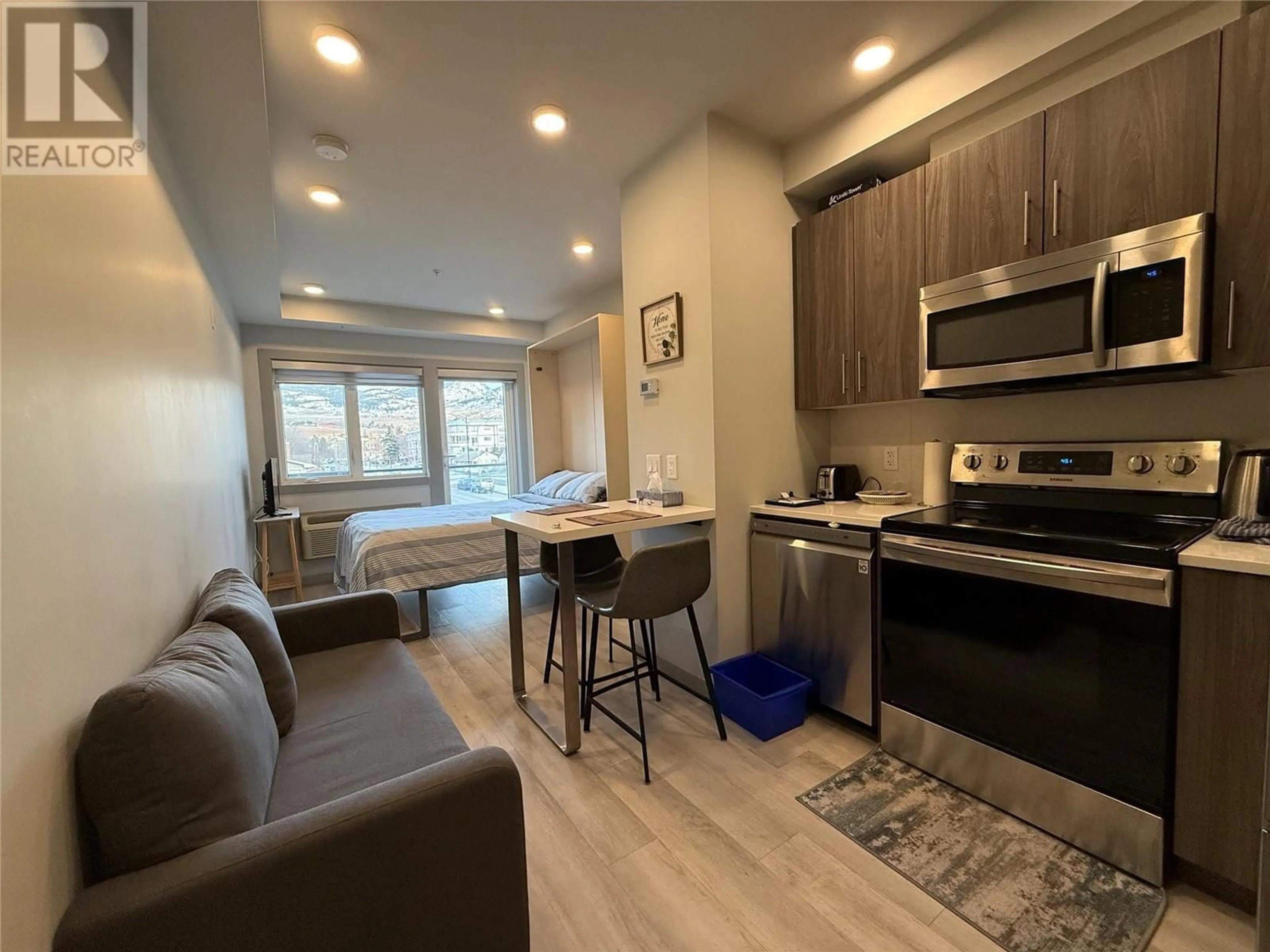 Open concept kitchen, wood/laminate floor for 225 - 345 DOUGALL ROAD NORTH, Kelowna British Columbia V1X3K8