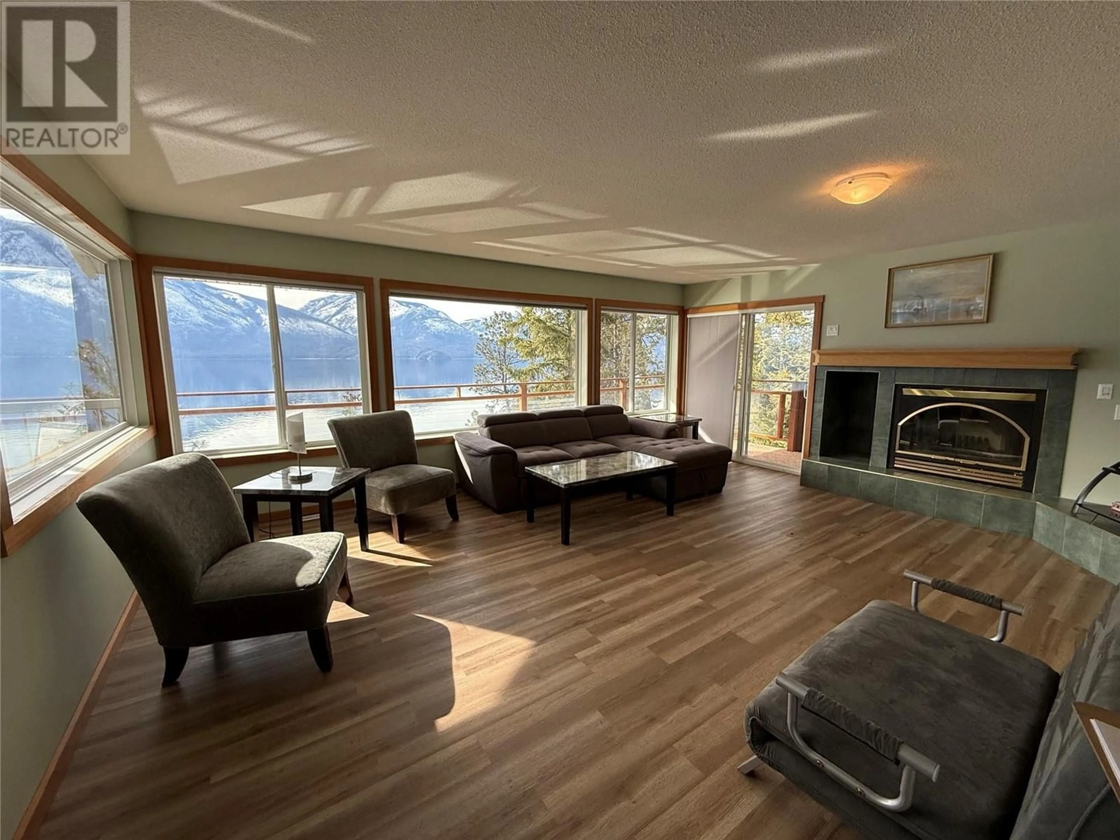Living room with furniture, wood/laminate floor for 9703 3A HIGHWAY, Kuskanook British Columbia V0B1A1