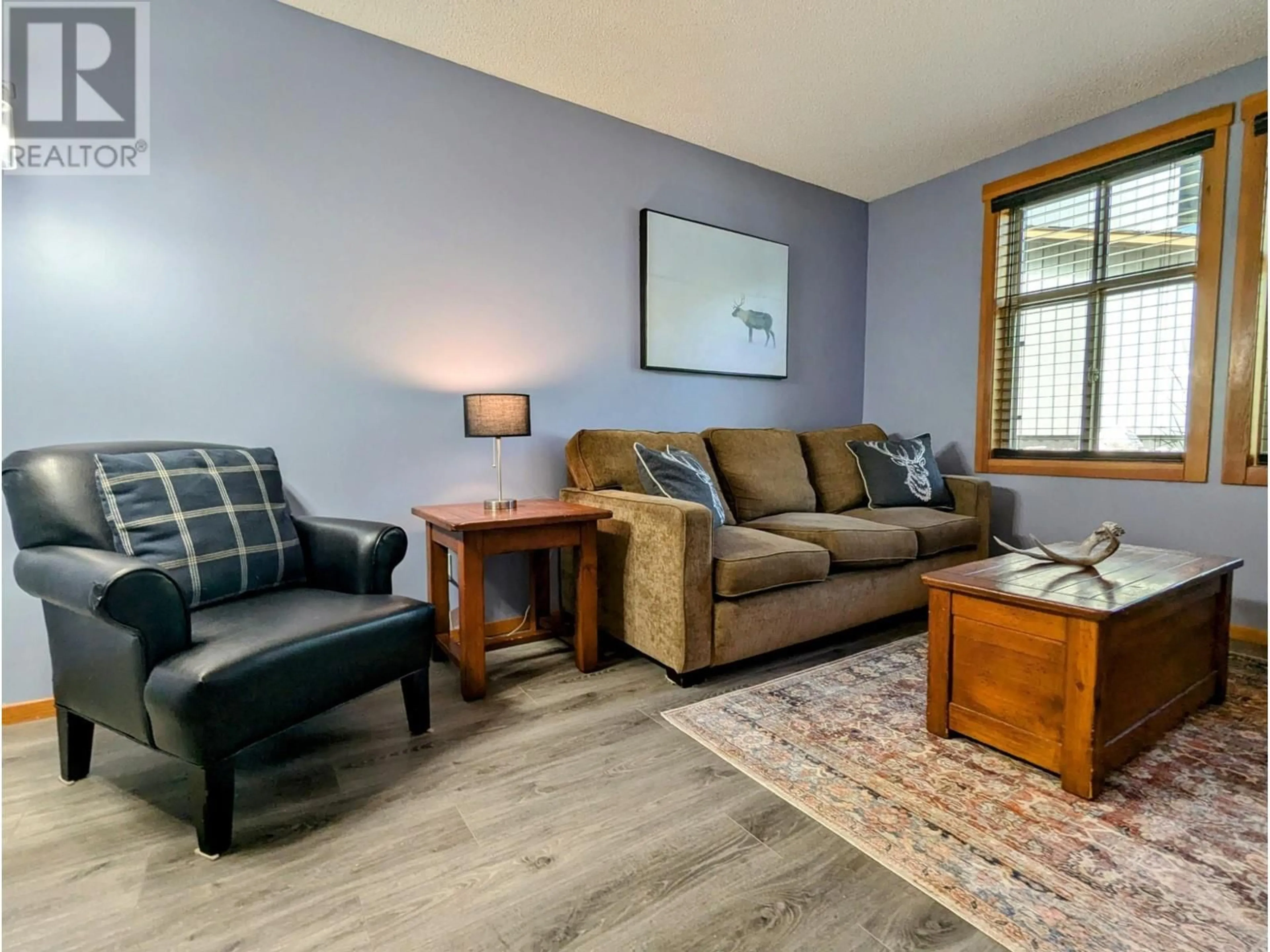 Living room with furniture, wood/laminate floor for 2060 SUMMIT Drive Unit# 104, Panorama British Columbia V0A1T0