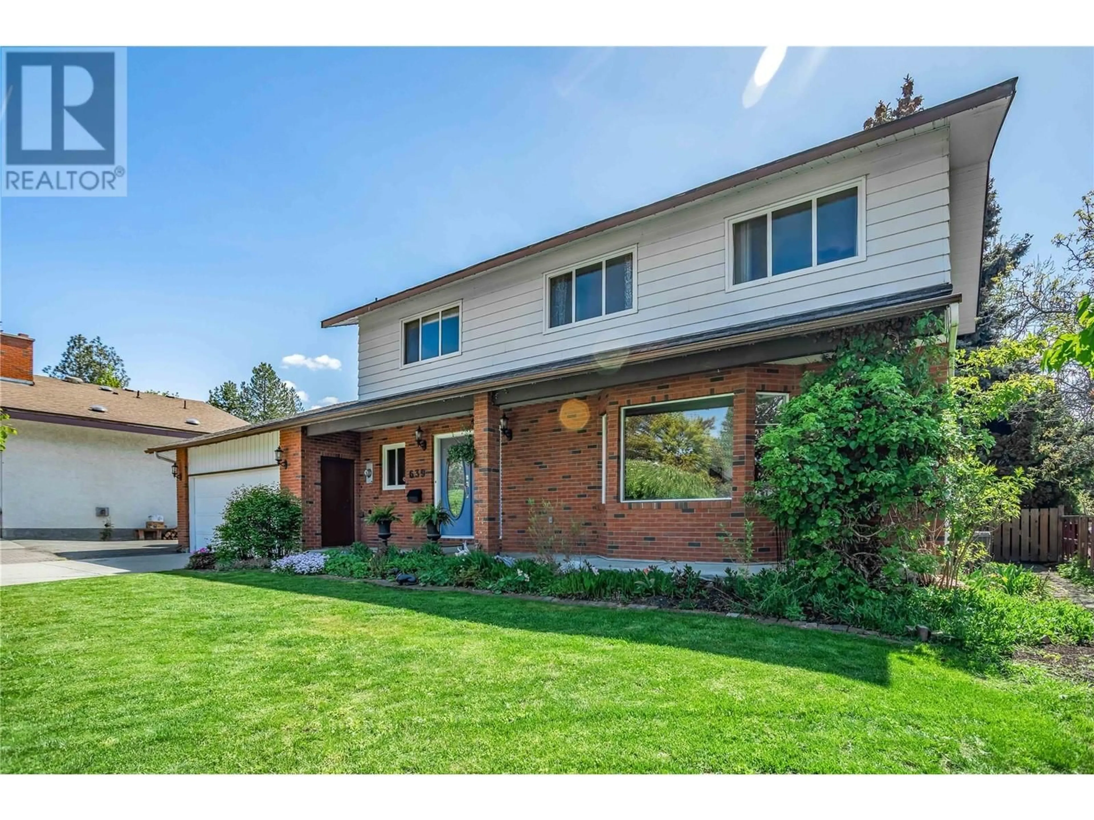 Home with brick exterior material, street for 639 TOMBY COURT, Kelowna British Columbia V1W2K9